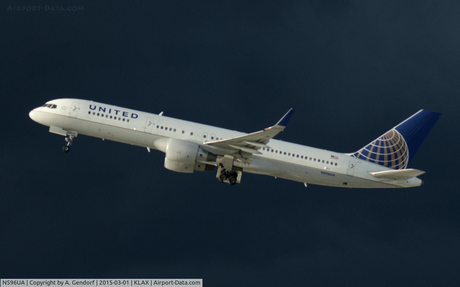 N596UA, 1998 Boeing 757-222 C/N 28749, United, is here climbing out at Los Angeles Int'l(KLAX)