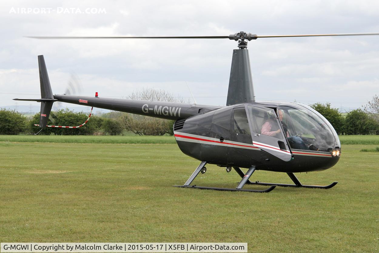 G-MGWI, 2000 Robinson R44 Astro C/N 0663, Robinson R44 Astro at the opening of Fishburn Airfield's new clubhouse, May 17th 2015.