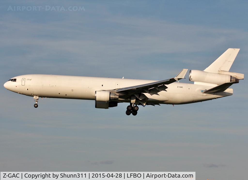 Z-GAC, 1998 McDonnell Douglas MD-11F C/N 48756, Landing rwy 32L in all white c/s with small 'operated by Global Africa Cargo' titles near cockpit
