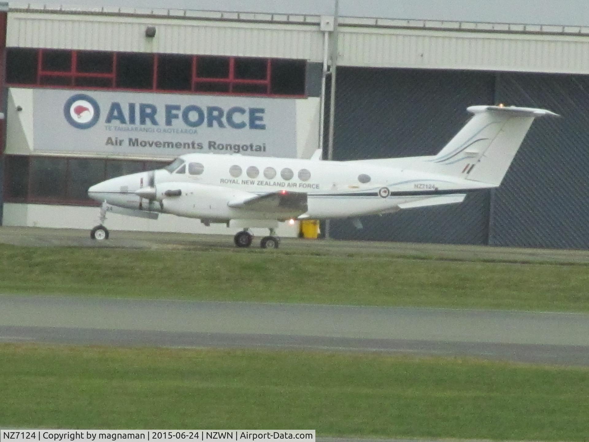 NZ7124, 2006 Raytheon B200 King Air C/N BB-1949, At welly - log shot across airfield from departure lounge