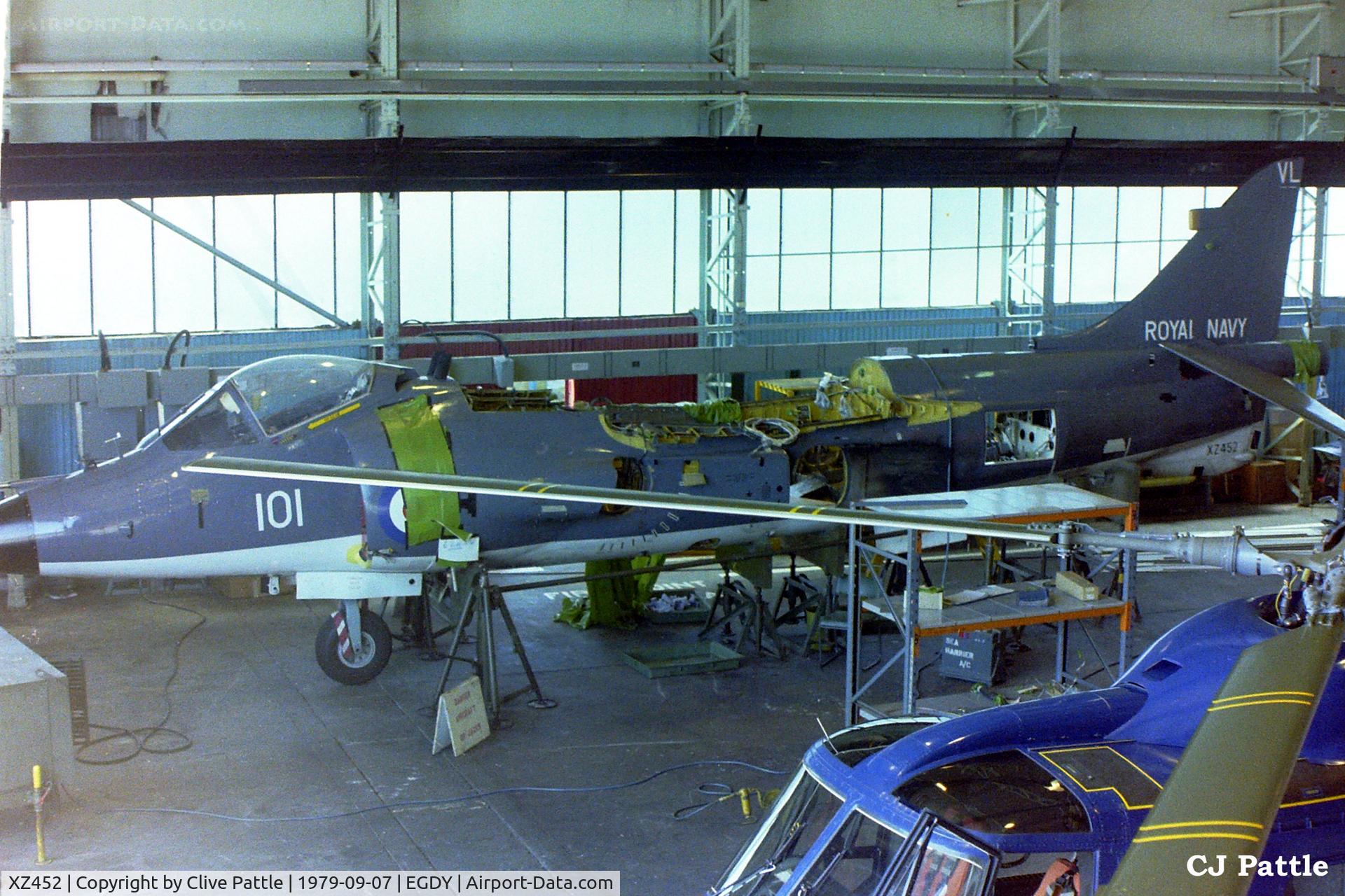 XZ452, 1979 British Aerospace Sea Harrier FRS.1 C/N 41H-912006, Scanned from neg - XZ452 of 899 NAS (though with no tail Sqn markings) undergoing deep maintenance in a hangar at RNAS Yeovilton EGDY. This aircraft was lost during the Falklands War.