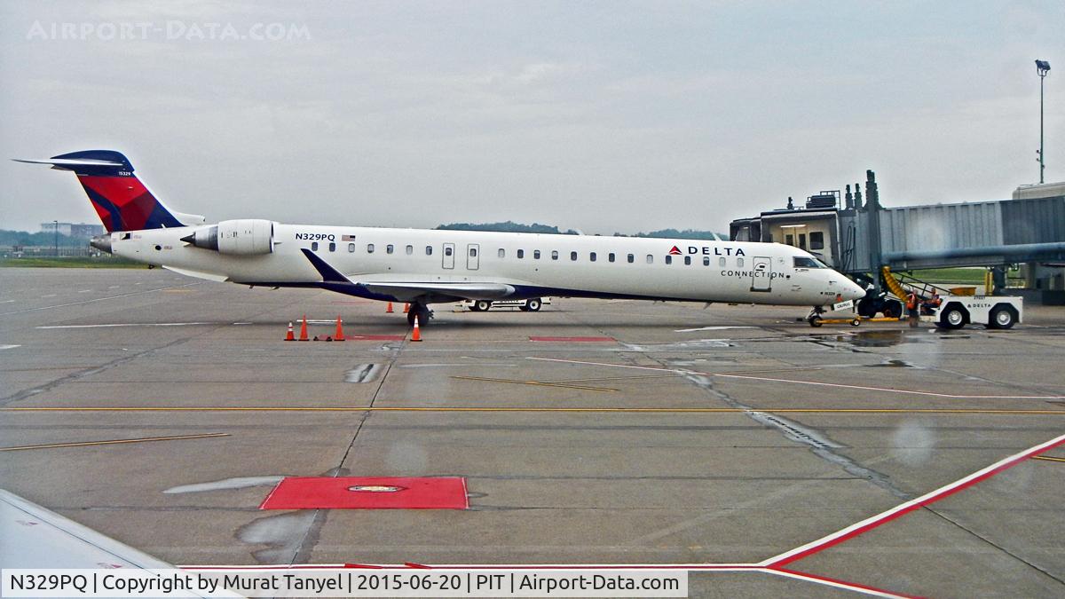 N329PQ, 2014 Bombardier CRJ-900 (CL-600-2D24) C/N 15329, At gate at PIT.
