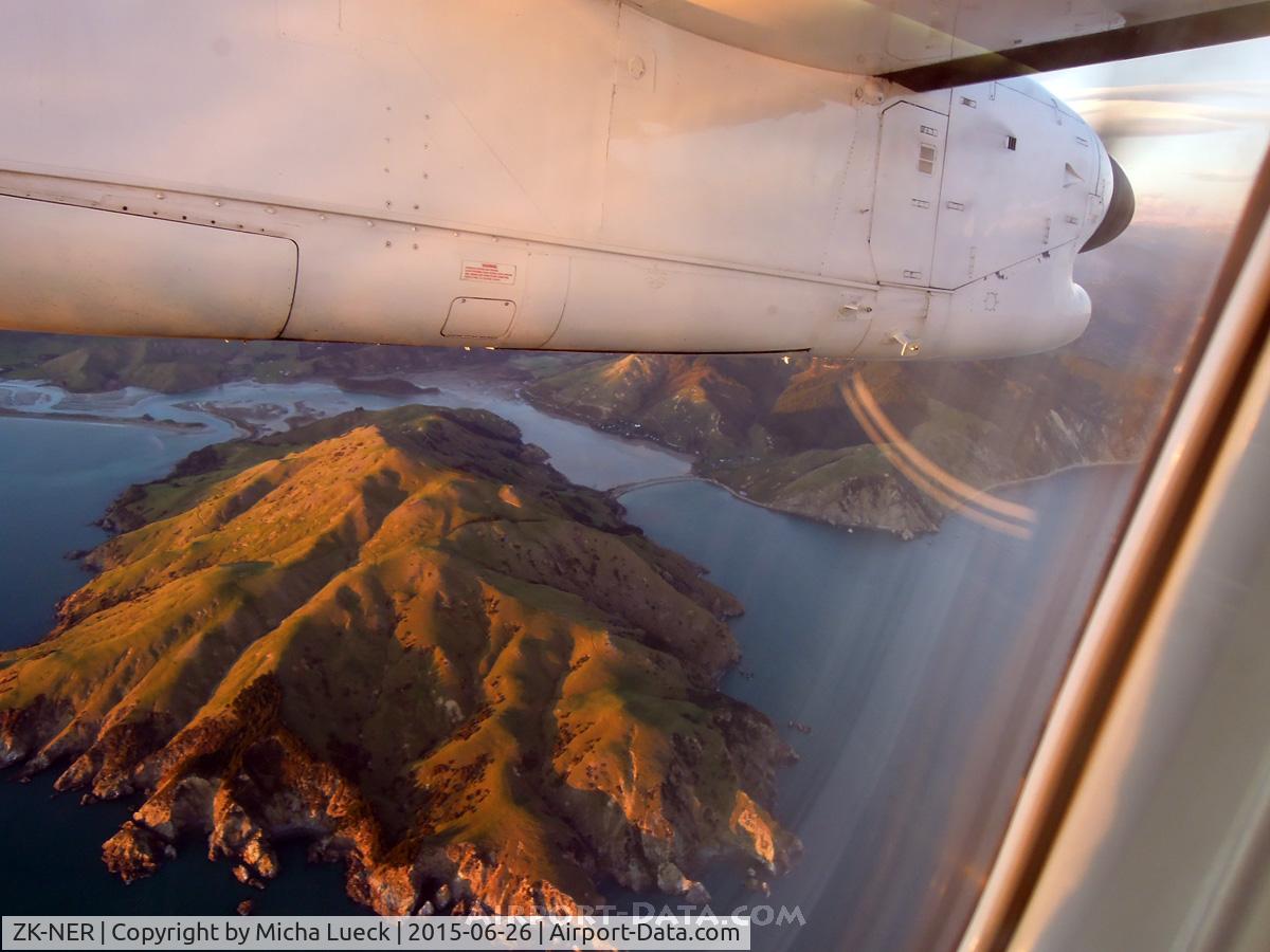ZK-NER, 1994 De Havilland Canada DHC-8-311 Dash 8 C/N 374, Crossing the beautiful Marlborough Sounds at sunrise on our way from WLG to NSN