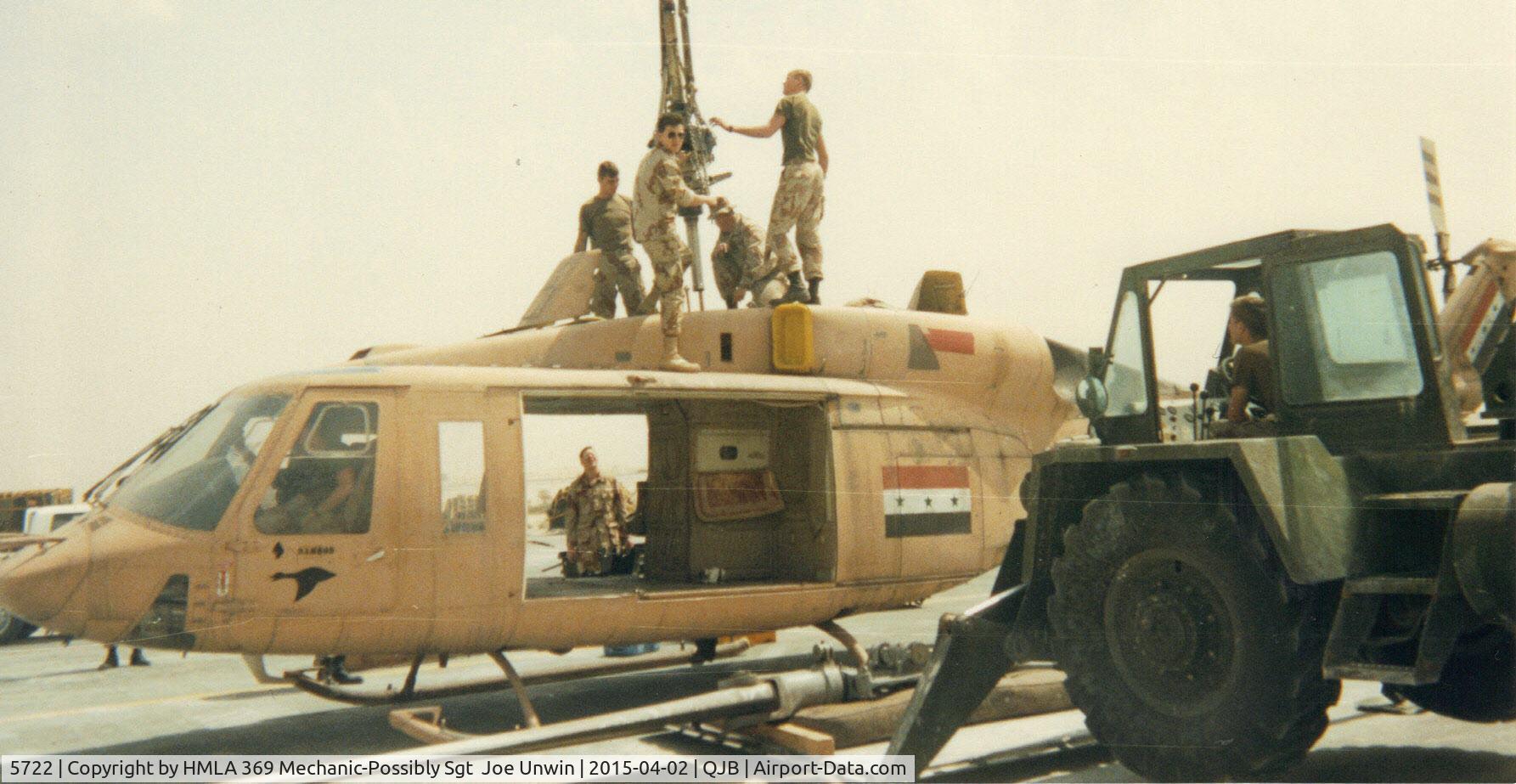5722, Bell 214ST C/N 28166, HMLA 369 Flight Line Crew dismantling 214ST for transport during desert storm.. (Me) CpL Sal Briones wearing sun glasses.. Had Sgt  Joe Unwin take photo using my disposable camera