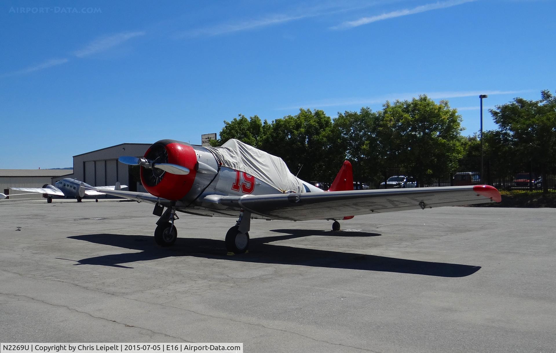 N2269U, North American Medore SNJ-4 C/N 88-12850, A North American SNJ-4 from nearby Reid Hillview Airport visiting South County Airport, CA. Parked at Magnum Aviation's transient parking.