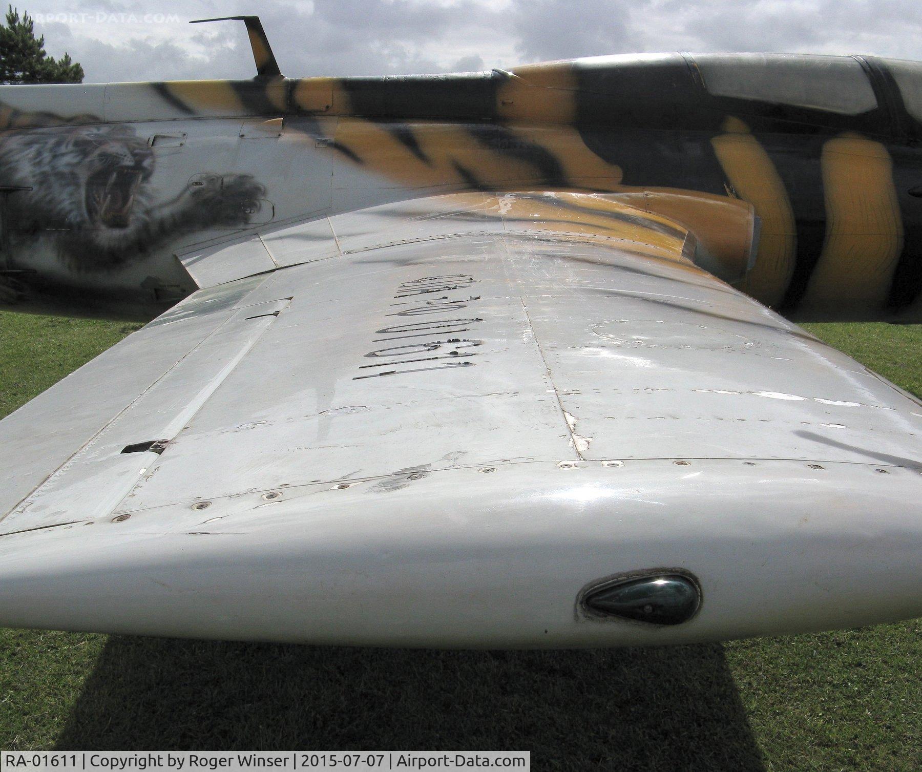 RA-01611, 1972 Aero L-29 Delfin C/N 294699, Off airport. In position as a static exhibit  by the Swansea Bay foreshore, Swansea, Wales ready for the Wales National Airshow 2015. The starboard wing of the Delfin is marked with the tail number on the upper surface. The aircraft was built in 1972.