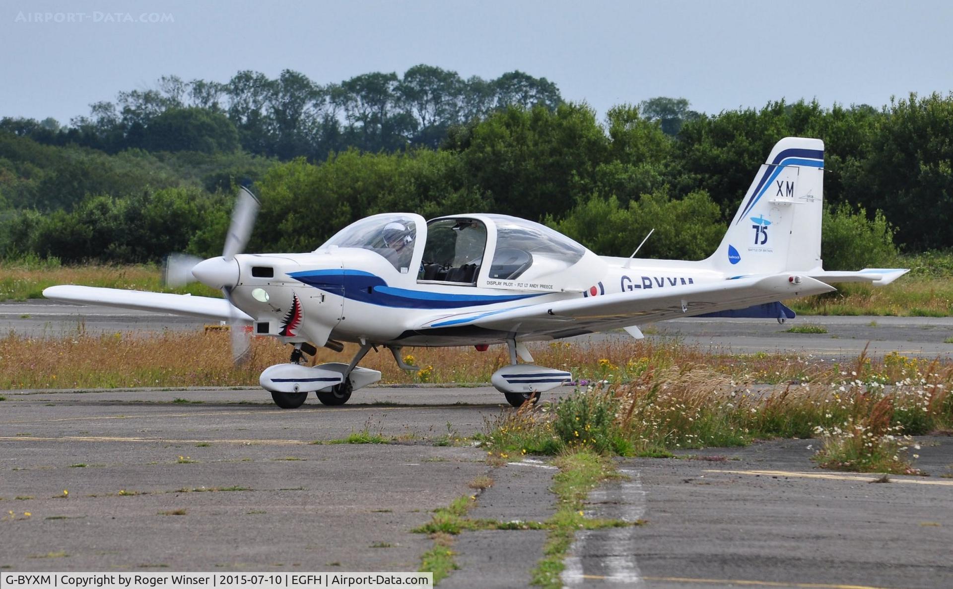 G-BYXM, 2001 Grob G-115E Tutor T1 C/N 82173/E, RAF Grob Tutor aircraft coded XM, the display aicraft for the Wales National Airshow 2015 returning from a practice session over Swansea Bay.