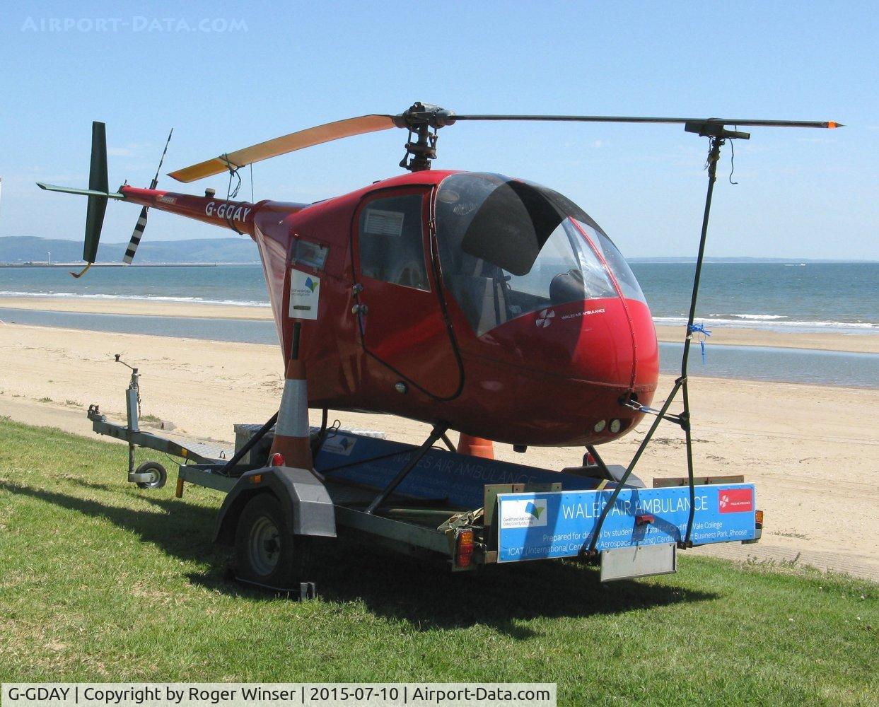 G-GDAY, 1987 Robinson R22 Beta C/N 0676, Off Airport. Grounded R-22 Beta helicopter used to raise funds for the Wales Air Ambulance charity in position by the Swansea foreshore ready for the Wales National Airshow 2015.