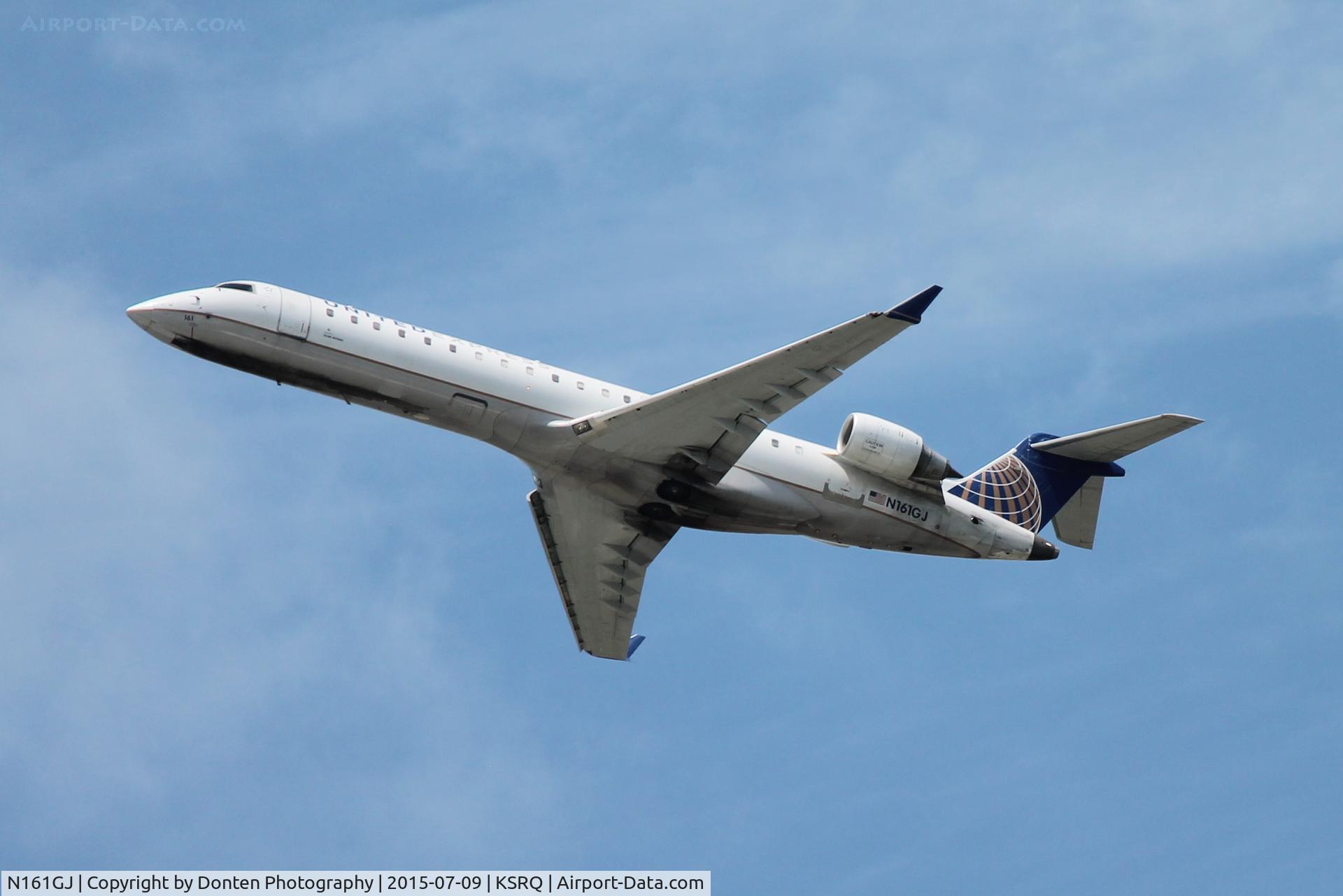 N161GJ, 2006 Bombardier CRJ-550 (CL-600-2C11) C/N 10253, United Flight 3653 operated by GoJet (N161GJ) depart Sarasota-Bradenton International Airport enroute to Chicago-OHare International Airport
