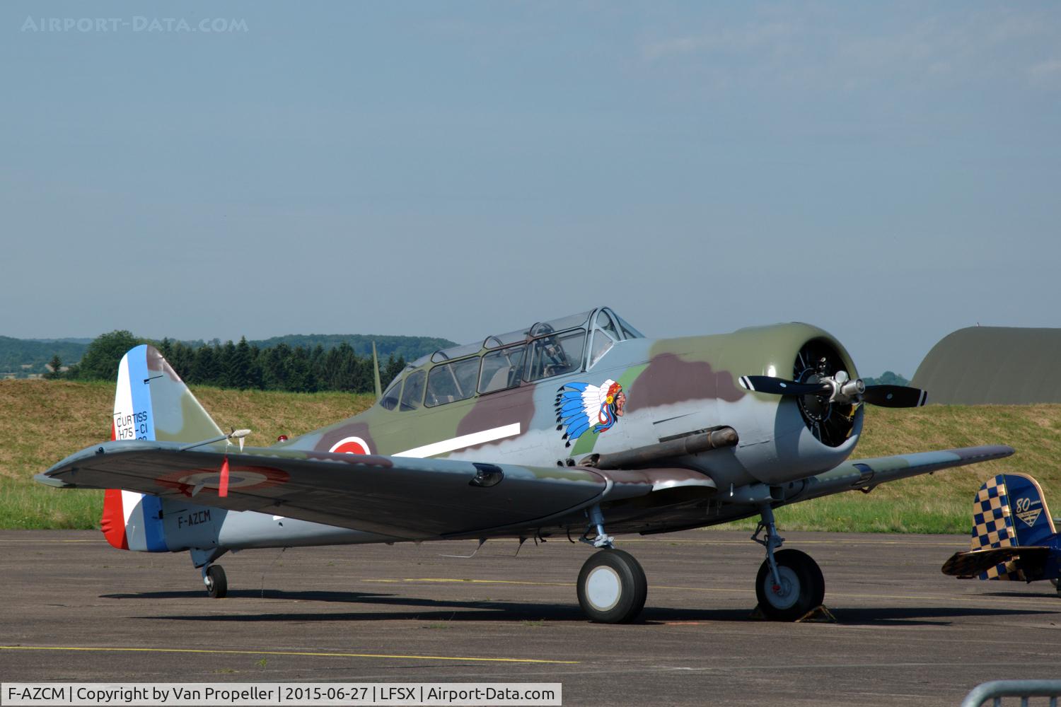 F-AZCM, 1951 North American T-6G Texan C/N 182-179, Texan in French Air Force Curtiss H75/C1 colour-scheme on the flightline of Luxeuil Air Base, France.