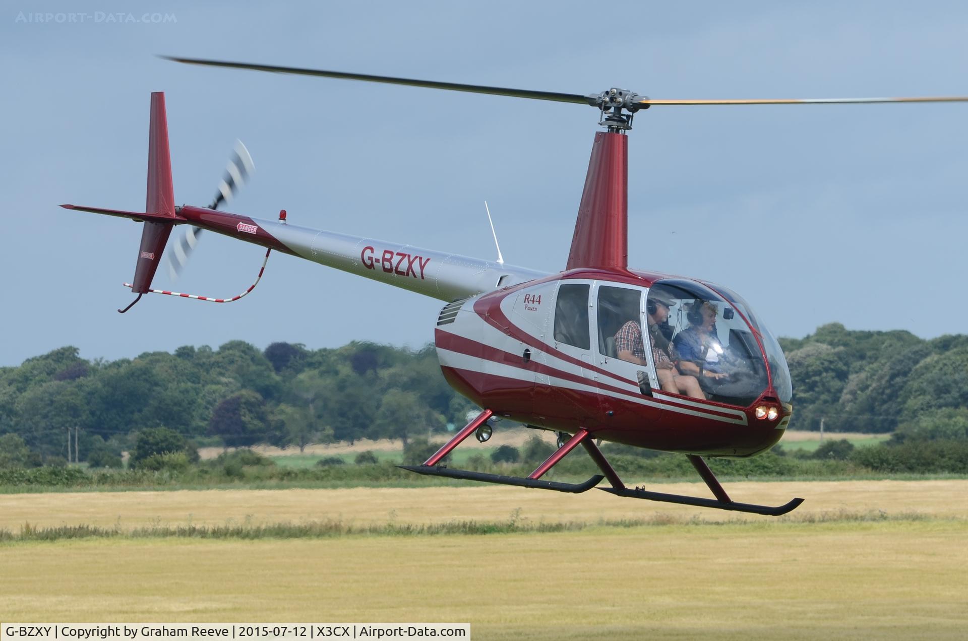 G-BZXY, 2001 Robinson R44 Raven C/N 1027, Departing from Northrepps.
