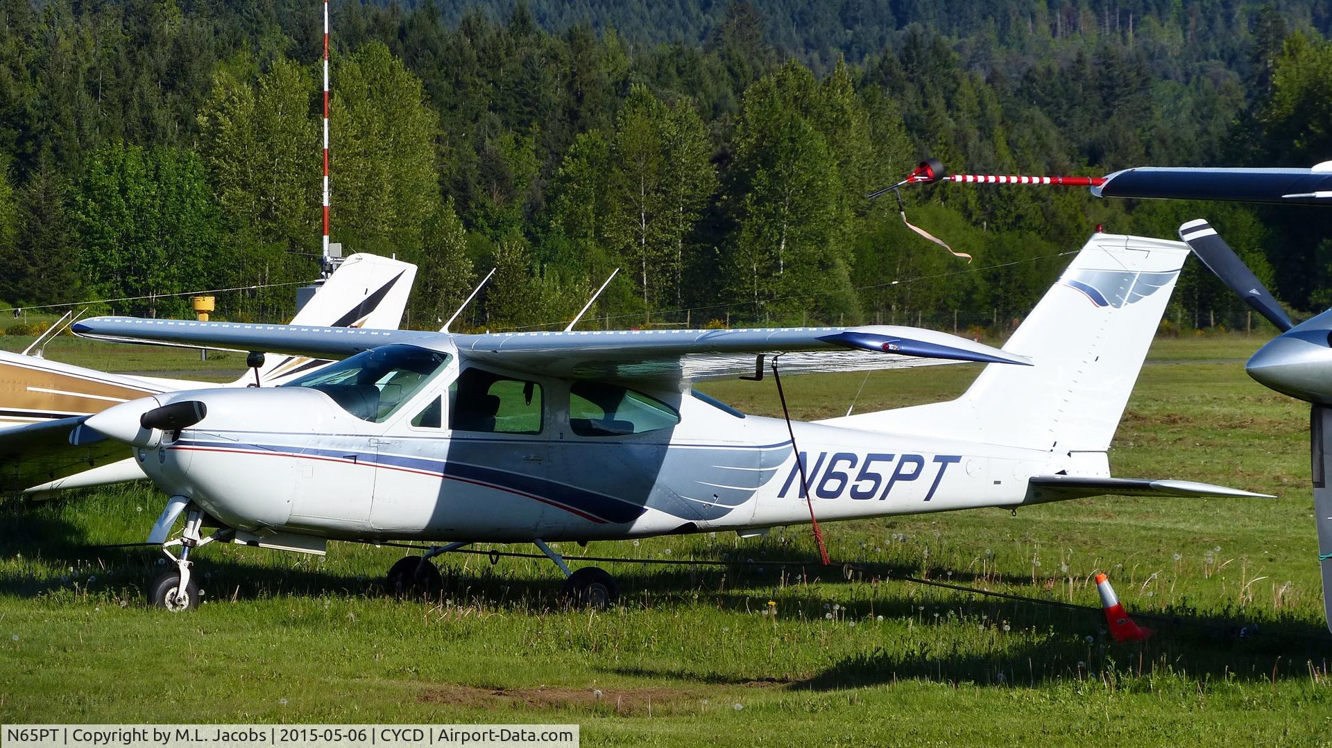 N65PT, 1976 Cessna 177RG Cardinal C/N 177RG1086, Parked in the grass field at Nanaimo airport.