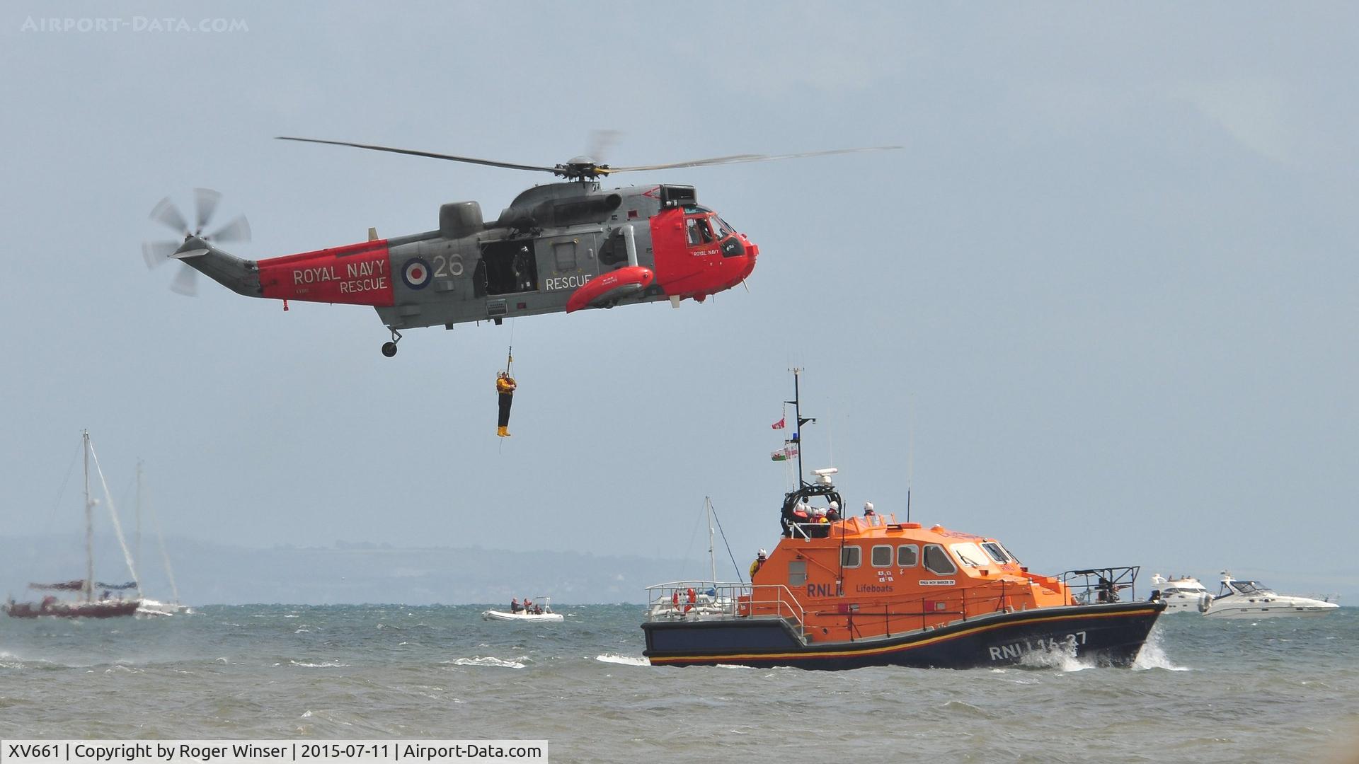 XV661, 1970 Westland Sea King HU.5 C/N WA649, Off airport. Royal Navy Sea King HU.5 helicopter coded (8)26 0f 771 NAS in a rescue demonstration with The Mumbles Lifeboat on the first day of the Wales National Airshow held over Swansea Bay.