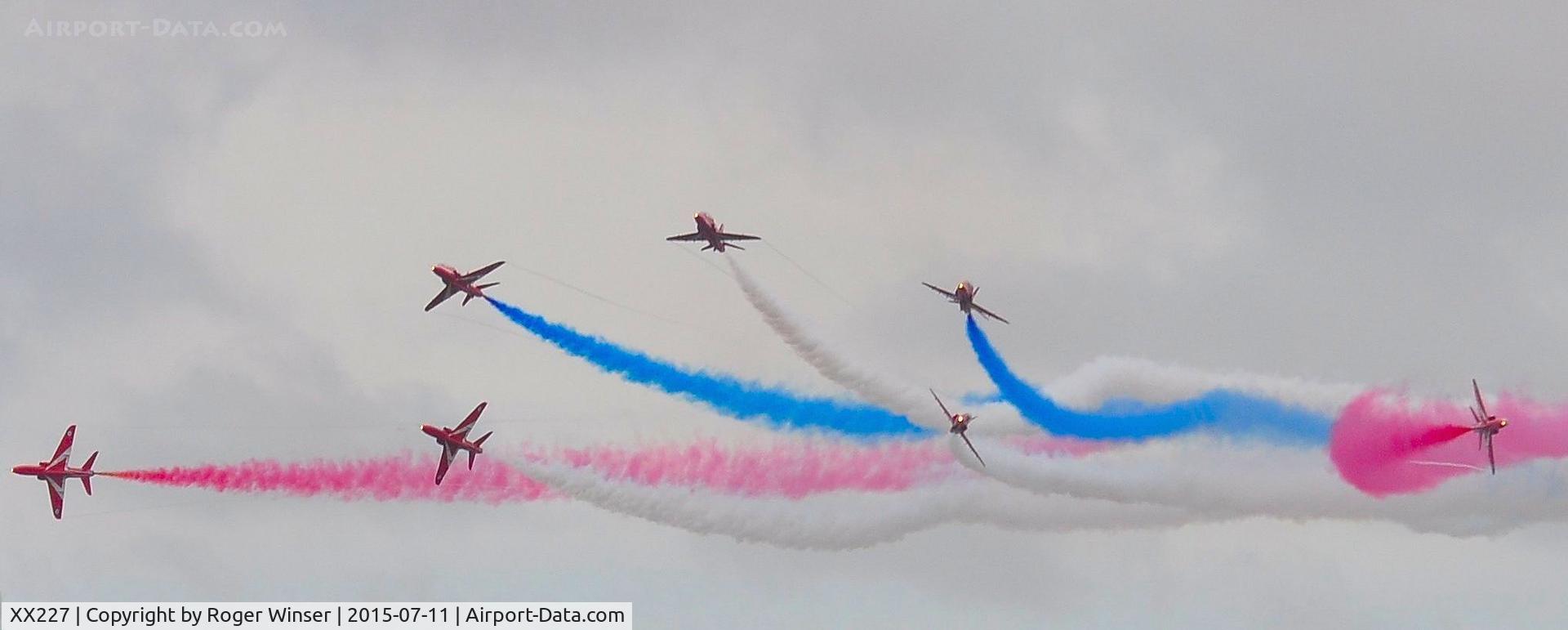 XX227, 1978 Hawker Siddeley Hawk T.1A C/N 063/312063, Off airport. XX227 leading the RAF Red Arrows in a 7-ship formation break on the first day of the Wales National Airshow held over Swansea Bay.