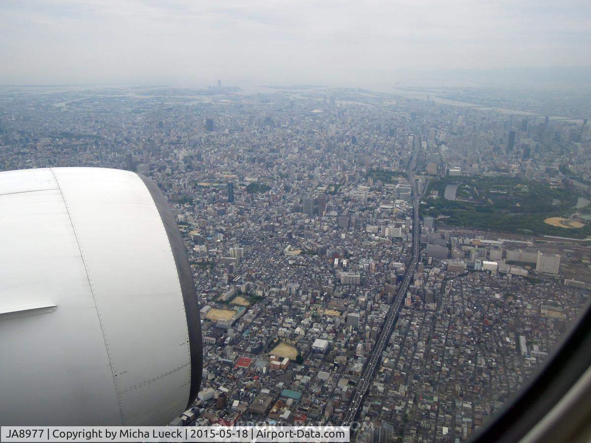 JA8977, 1996 Boeing 777-289 C/N 27636, On approach to Itami