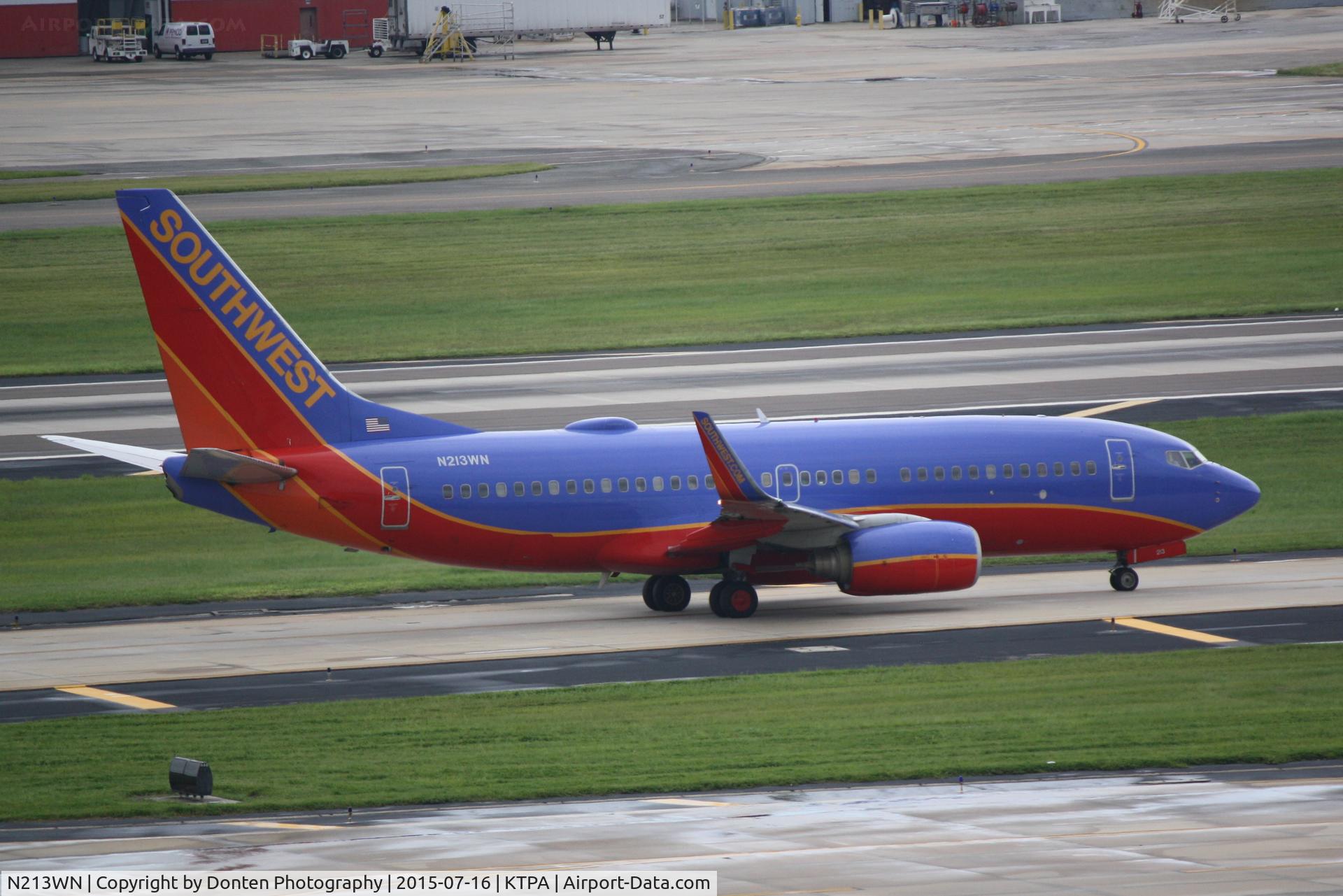 N213WN, 2005 Boeing 737-7H4 C/N 34217, Southwest Flight 662 (N213WN) taxis at Tampa International Airport prior to flight to Albany International Airport