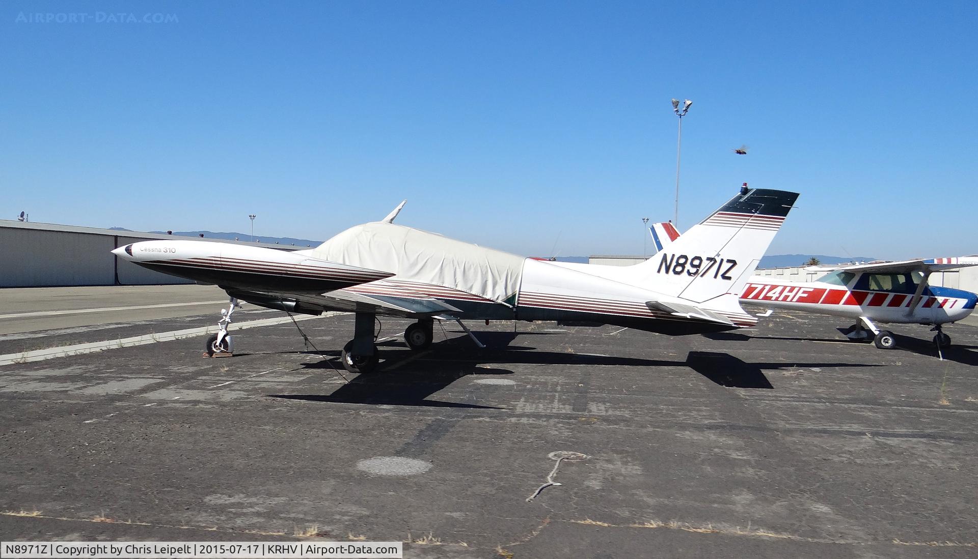 N8971Z, 1962 Cessna 310G C/N 310G0071, San Jose State University's 1962 Cessna 310 (hasen't flown in years and probably never will) in a new tie down in front of the SJSU hangar at Reid Hillview Airport, CA.