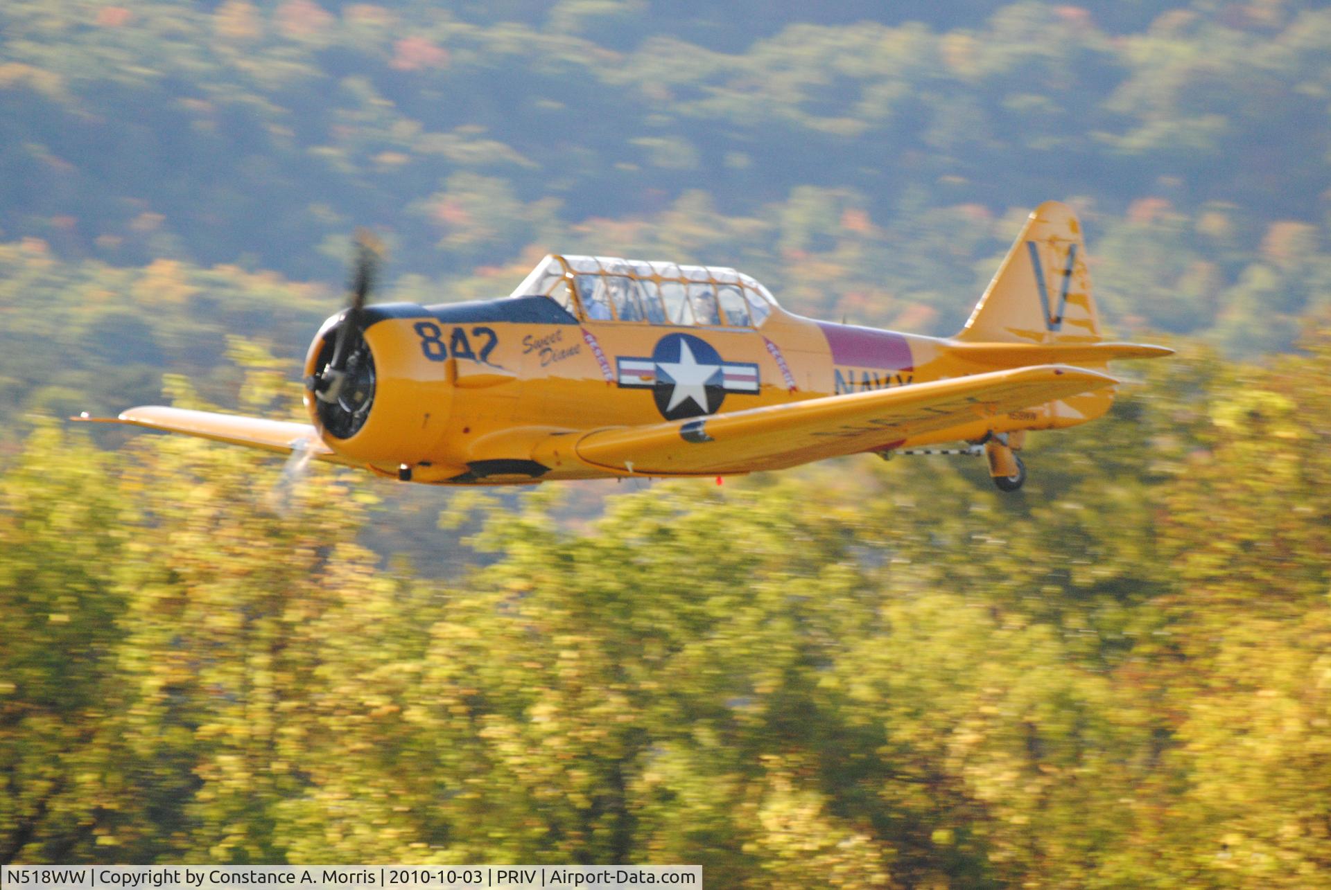 N518WW, North American SNJ-5C Texan Texan C/N 88-14866, I took picture 10/3/10 at Mohawk Ski Dive, Scotia, NY.  Plane on fly by and performed a roll.  Took many pictures and surprised camera kept up with speed. N518W