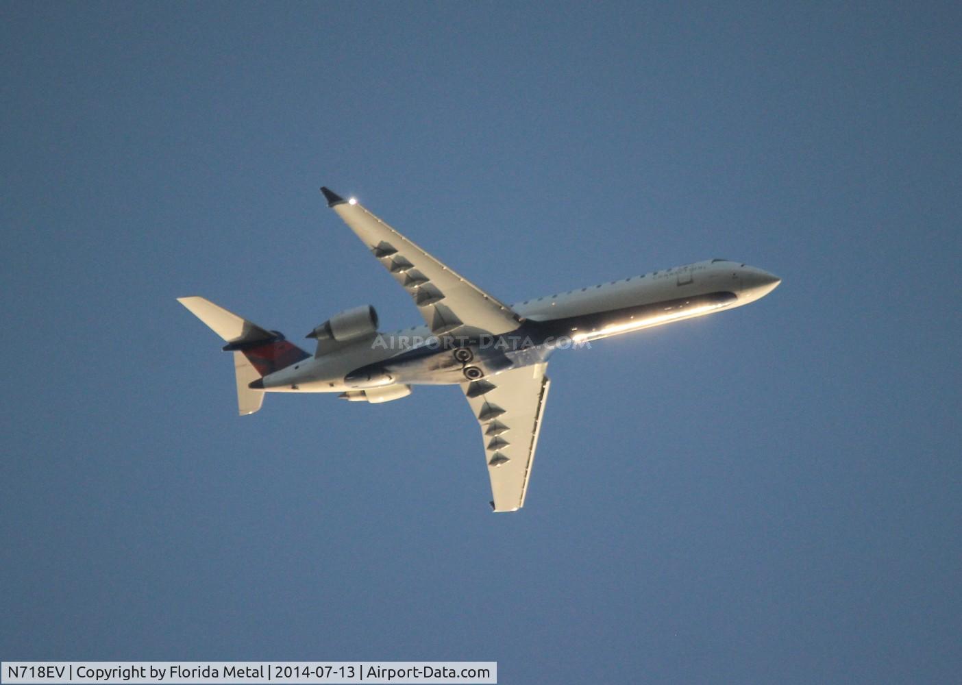 N718EV, 2003 Bombardier CRJ-701 (CL-600-2C10) Regional Jet C/N 10095, Delta Connection CRJ-700 over Livonia Michigan at 7,000 ft on downwind for DTW
