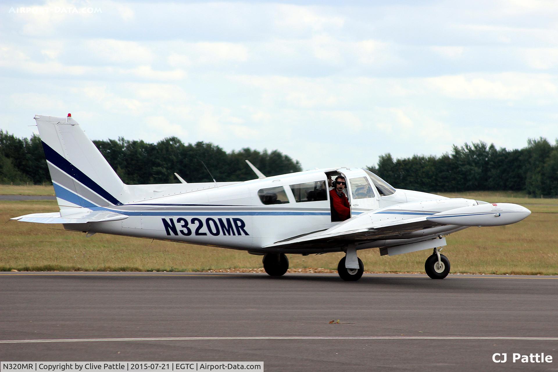 N320MR, 1969 Piper PA-30-160 C Twin Comanche C/N 30-1917, Taxy in at Cranfield, Bedfordshire. UK EGTC with the right hand passenger keen to exit ....