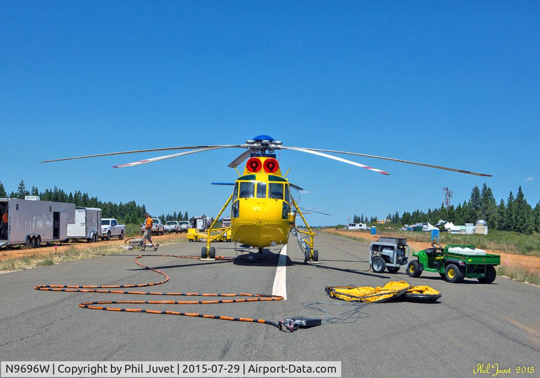 N9696W, 1960 Sikorsky S-61A C/N 61147, Parked on runway at Blue Canyon Airport, CA. It is rigged for water basket water delivery in this photo. Aircraft does not have a water tank in the fuselage, but a 2000 gallon tank can be attached to the belly.