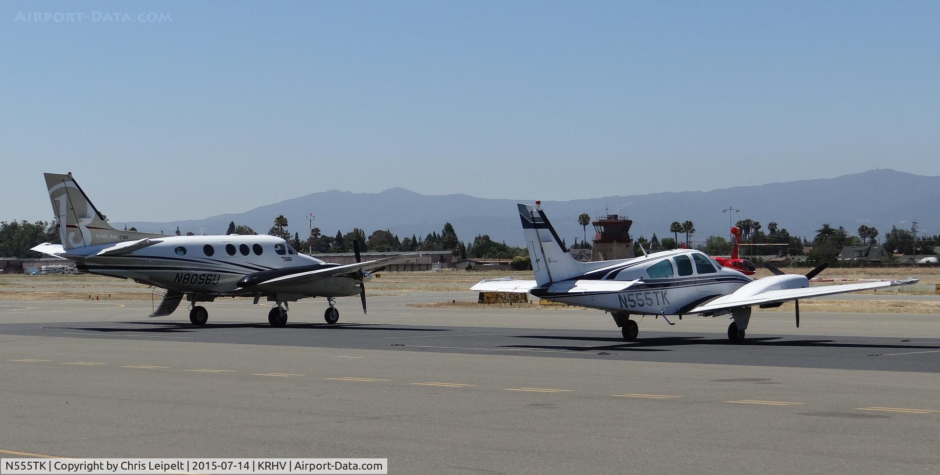 N555TK, 1976 Beech 95-B55 (T42A) Baron C/N TC-2001, The local 1976 Beechcraft Baron 55 and local King Air C90B sitting on the transient ramp at Reid Hillview Airport, CA before heading off so Sacramento Executive Airport.