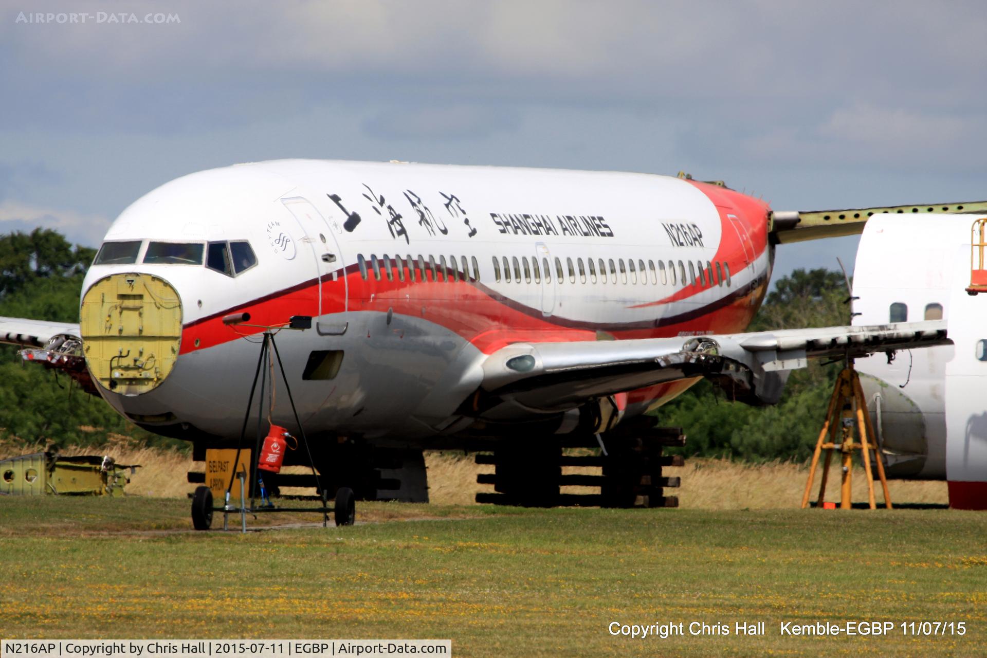 N216AP, 1998 Boeing 737-7Q8 C/N 28216, ex Shanghai Airlines in the scrapping area at Kemble