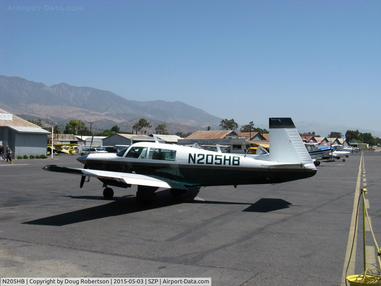 N205HB, 1977 Mooney M20J 201 C/N 24-0288, 1977 Mooney M20J 201, Lycoming IO-360-A1B6D 200 Hp, first year of Roy LoPresti's drag reduction to the M20F resulting in M-20J 201 model with 21 knot speed increase. The 201 is meaningful. At fuel dock.
