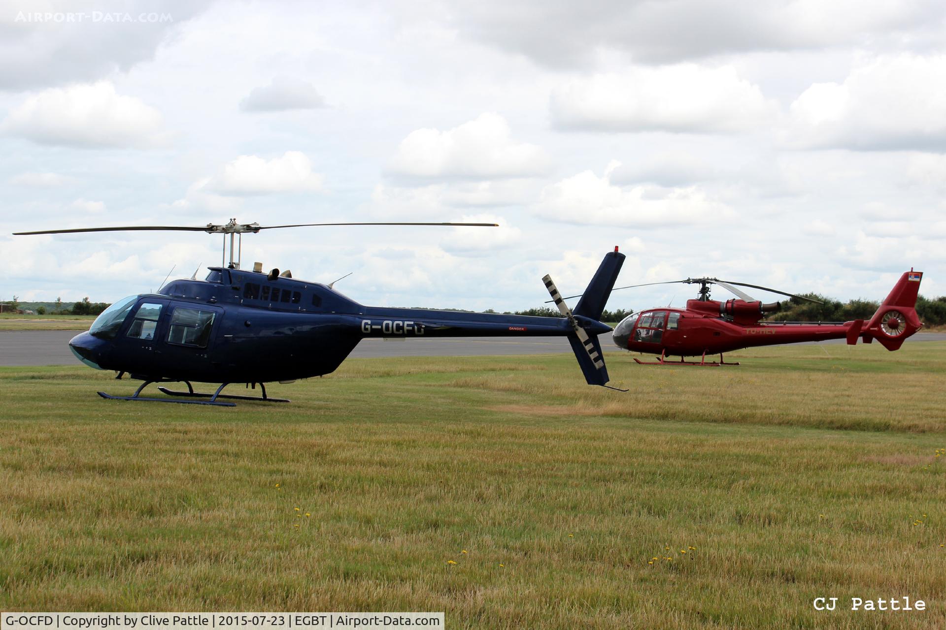 G-OCFD, 1980 Bell 206B JetRanger III C/N 3165, Parked in the designated heli spots at Turweston Aerodrome EGBT