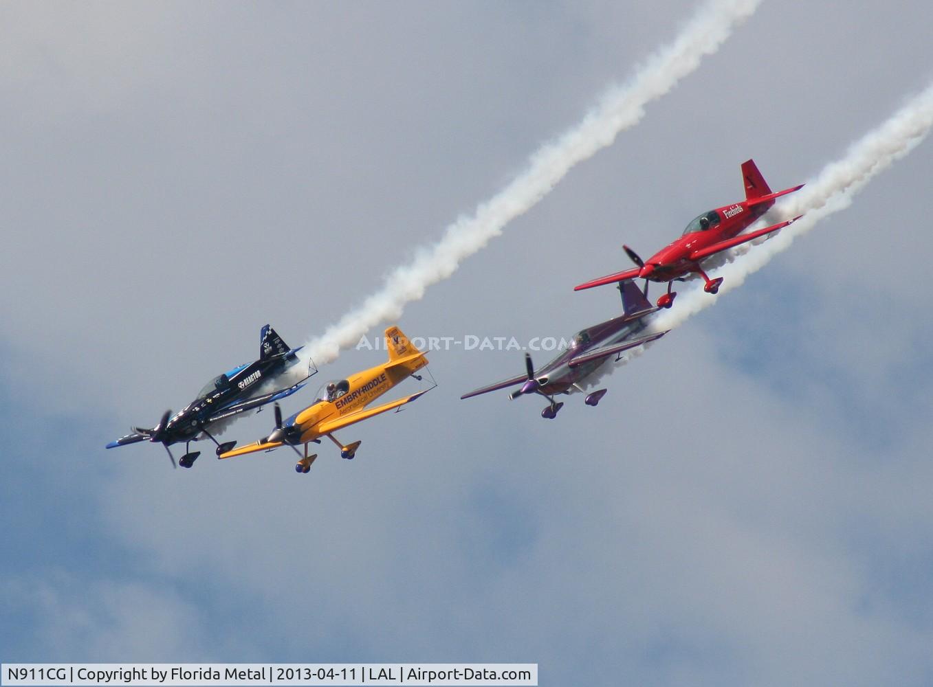 N911CG, 1993 Extra EA-300S C/N 01, Firebirds Extra 300 Jack in formation with 3 others at Sun N Fun