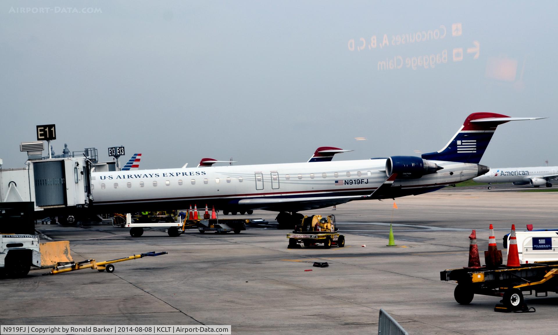 N919FJ, 2004 Bombardier CRJ-900ER (CL-600-2D24) C/N 15019, At the gate CLT