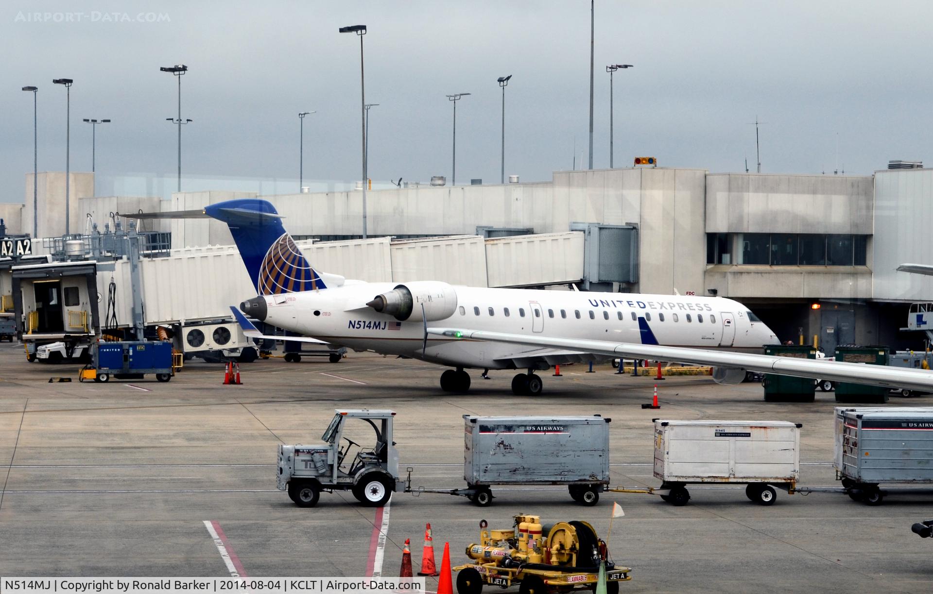 N514MJ, 2003 Bombardier CRJ-700 (CL-600-2C10) Regional Jet C/N 10116, At the gate CLT