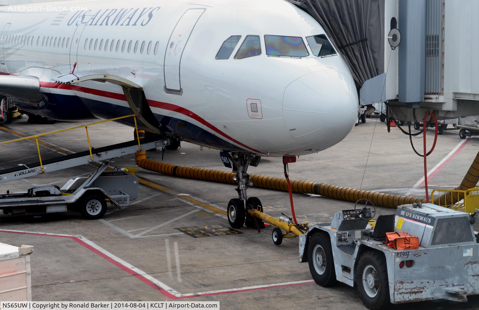 N565UW, 2012 Airbus A321-231 C/N 5409, Aircraft nose and tow bar CLT
