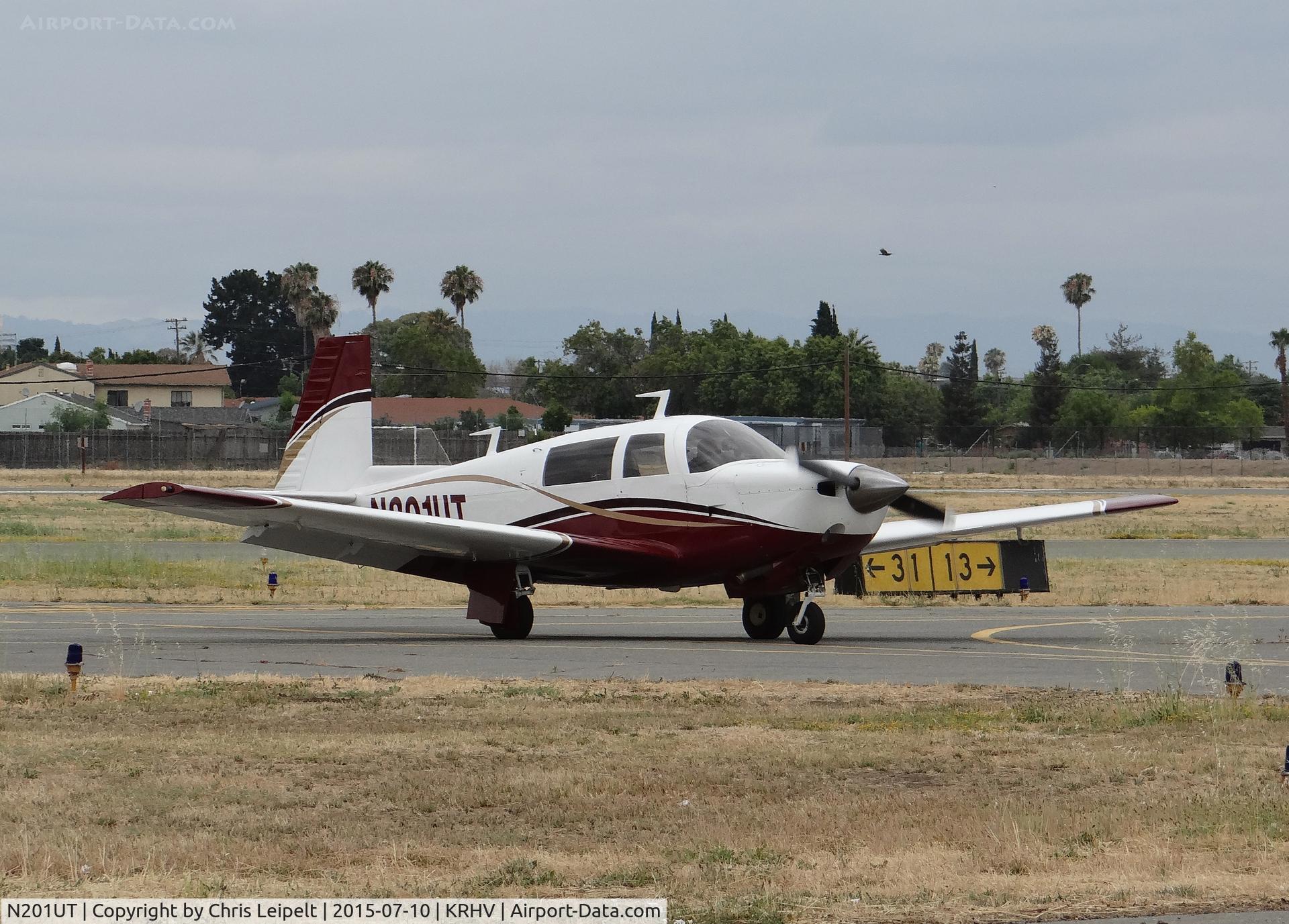 N201UT, 1977 Mooney M20J 201 C/N 24-0313, A very nice local 1977 Mooney M20J clear of 31R and taxing to its tie down under the shelters at Reid Hillview Airport, CA.