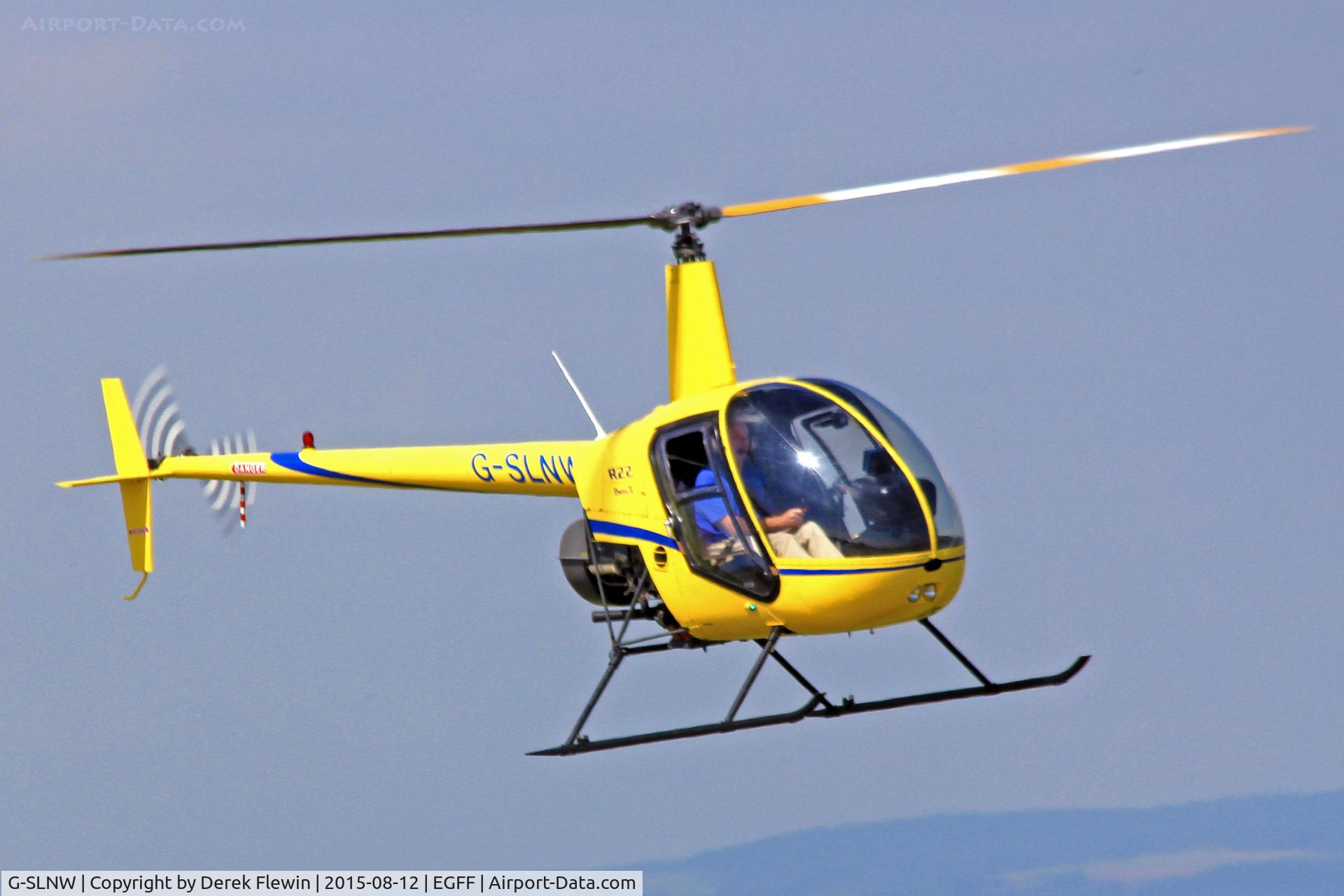 G-SLNW, 2003 Robinson R22 Beta II C/N 3524, R22, previously G-LNIC, seen lifting en-route to Fairoaks.