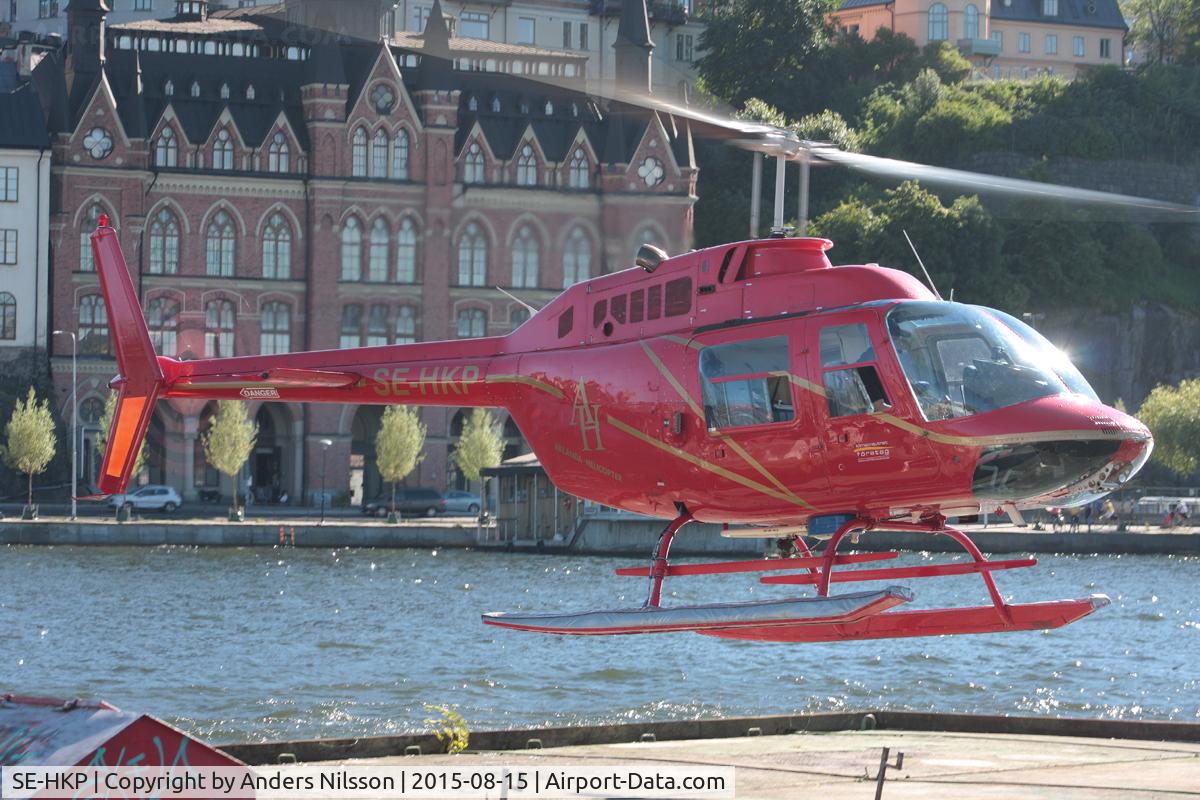 SE-HKP, 1980 Bell 206B C/N 2987, Departing helipad near Old Town in Stockholm, Sweden.