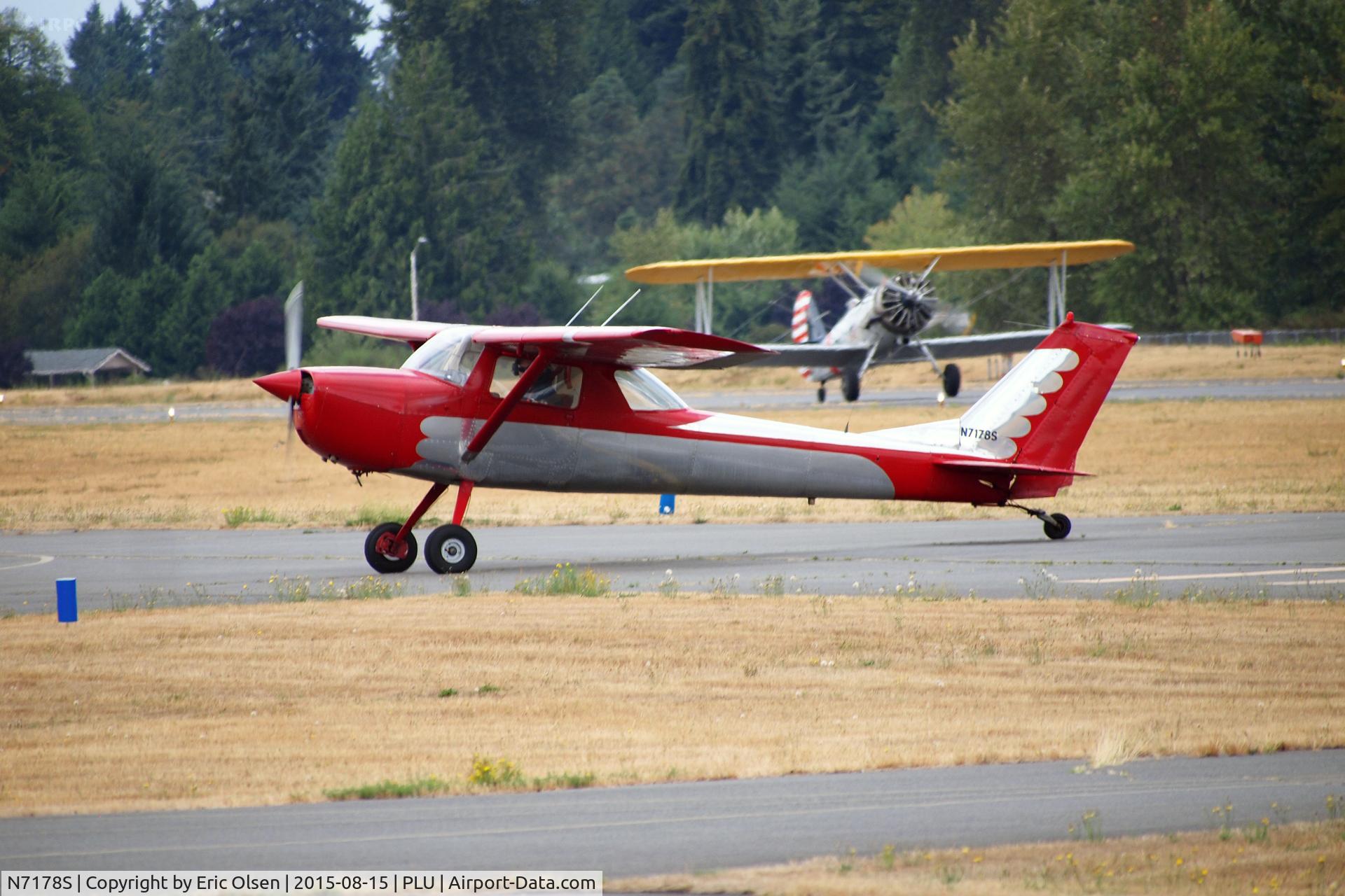 N7178S, 1967 Cessna 150H C/N 15067878, 1967 Taxing in at Thun Field with a Naval Aircraft Factory N3N in the background taxing in for Cubs and Classics.