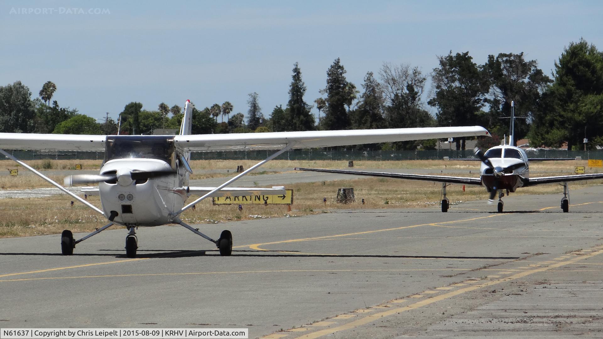 N61637, 1975 Cessna 172M C/N 17264691, A locally based 1975 Cessna 172M taxing out for departure while a local Piper Malibu Matrix taxis to its hangar at Reid Hillview Airport, CA.
