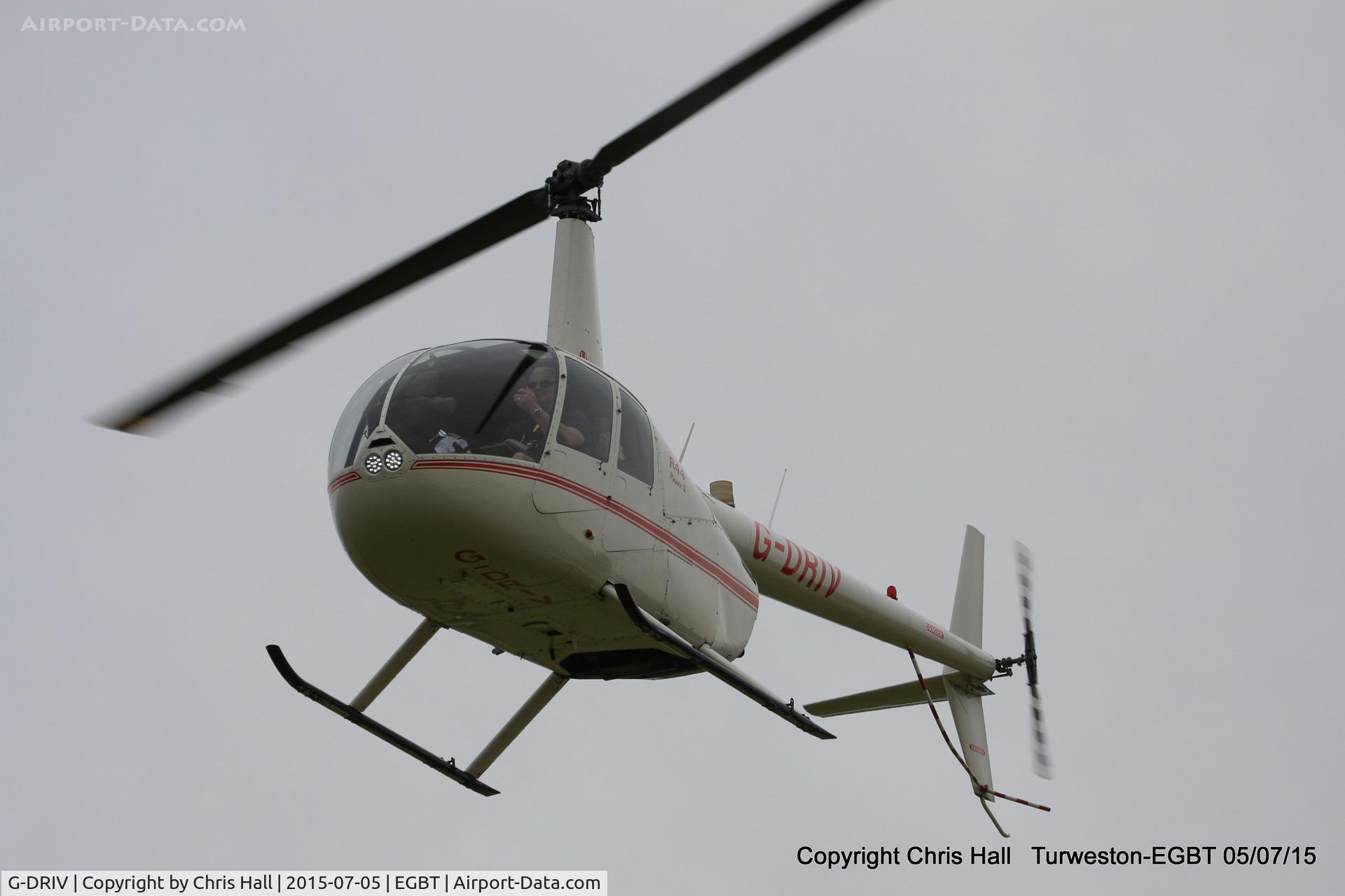 G-DRIV, 2003 Robinson R44 Raven II C/N 10126, ferrying race fans to the British F1 Grand Prix at Silverstone