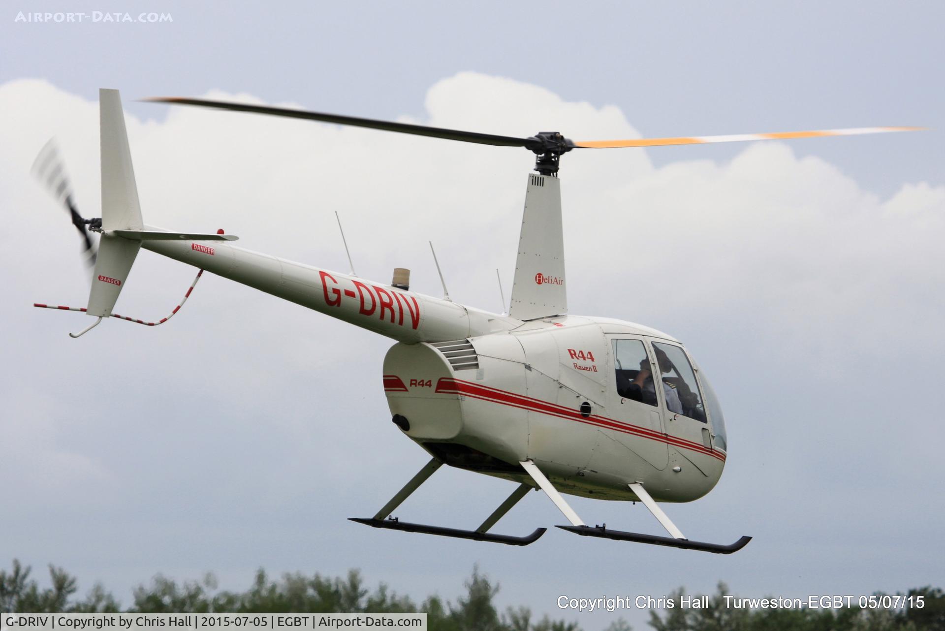 G-DRIV, 2003 Robinson R44 Raven II C/N 10126, ferrying race fans to the British F1 Grand Prix at Silverstone