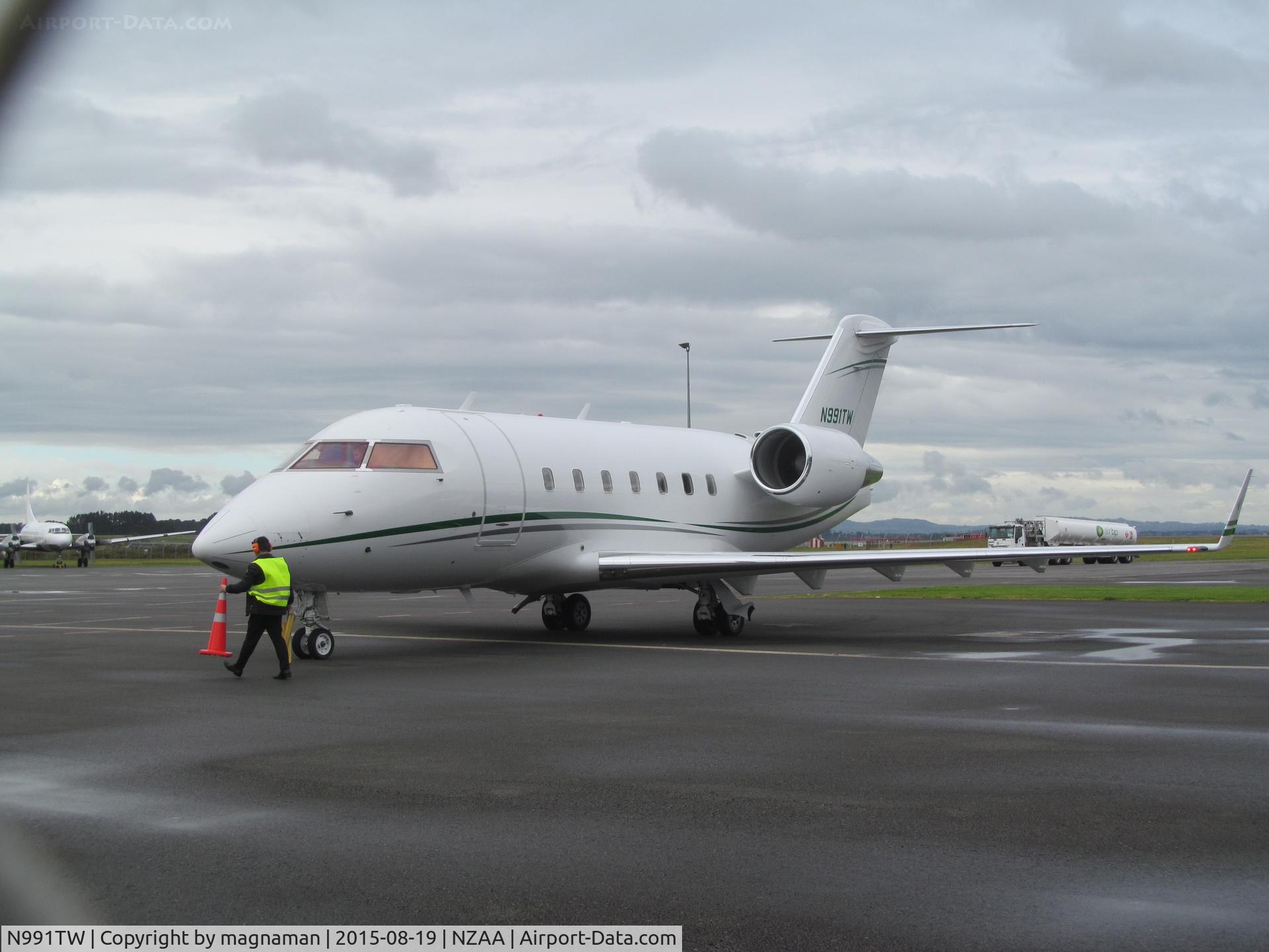 N991TW, 1997 Canadair Challenger 604 (CL-600-2B16) C/N 5333, on stand (through wire fence!)