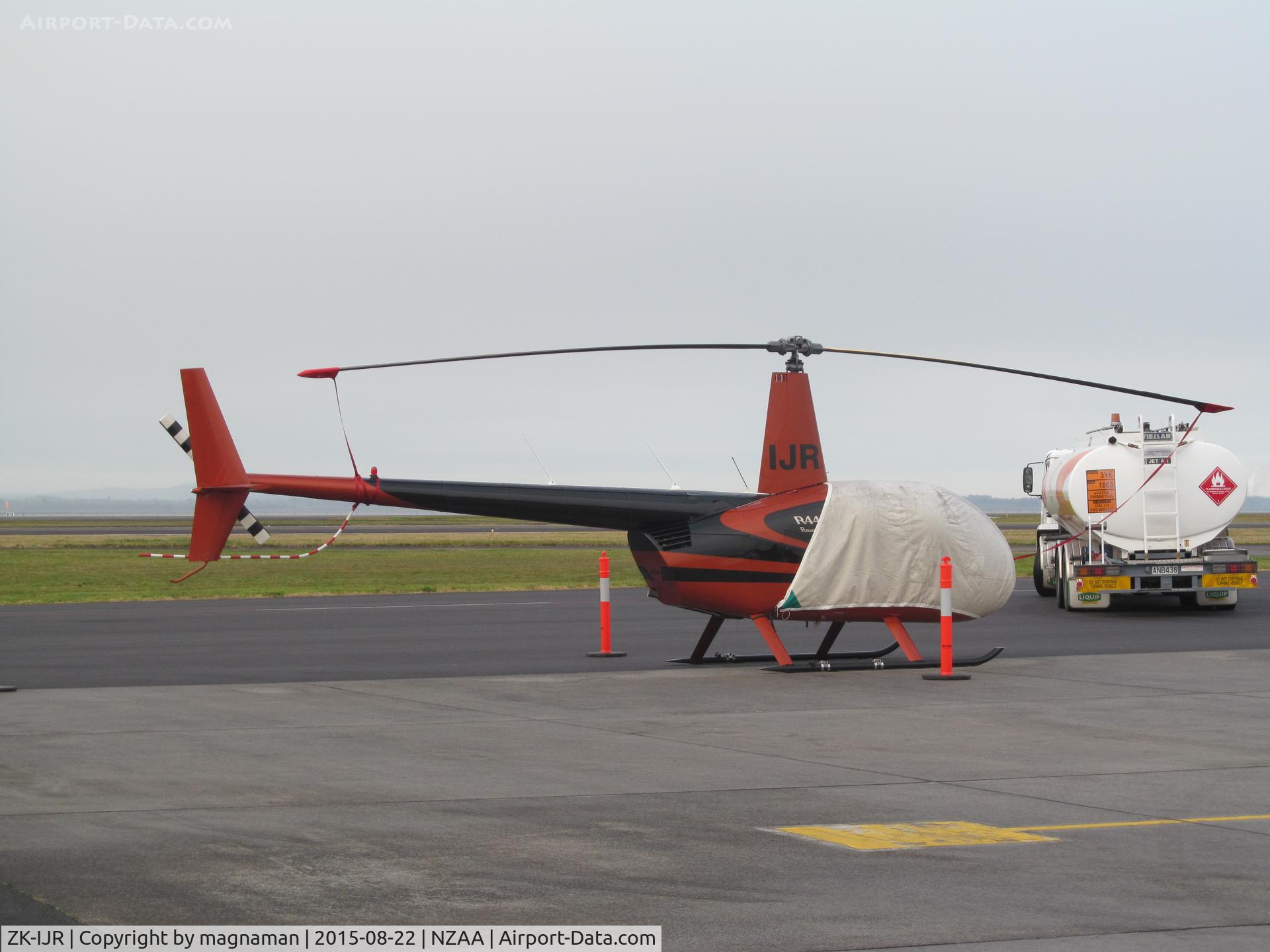 ZK-IJR, Robinson R44 II C/N 10828, on biz jet apron - AKL