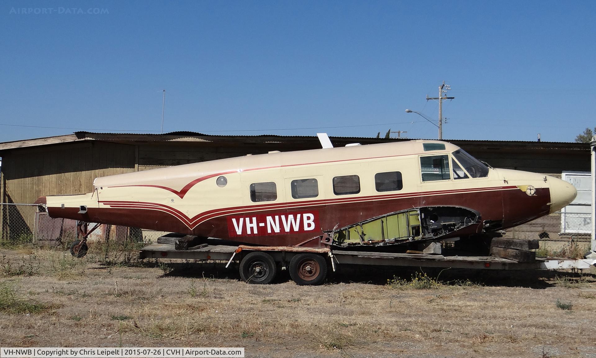 VH-NWB, 1960 Beech G18S C/N BA-548, A 1960 Beech G18S sitting on an old trailer never to fly again at Hollister Municipal Airport, Hollister, CA.