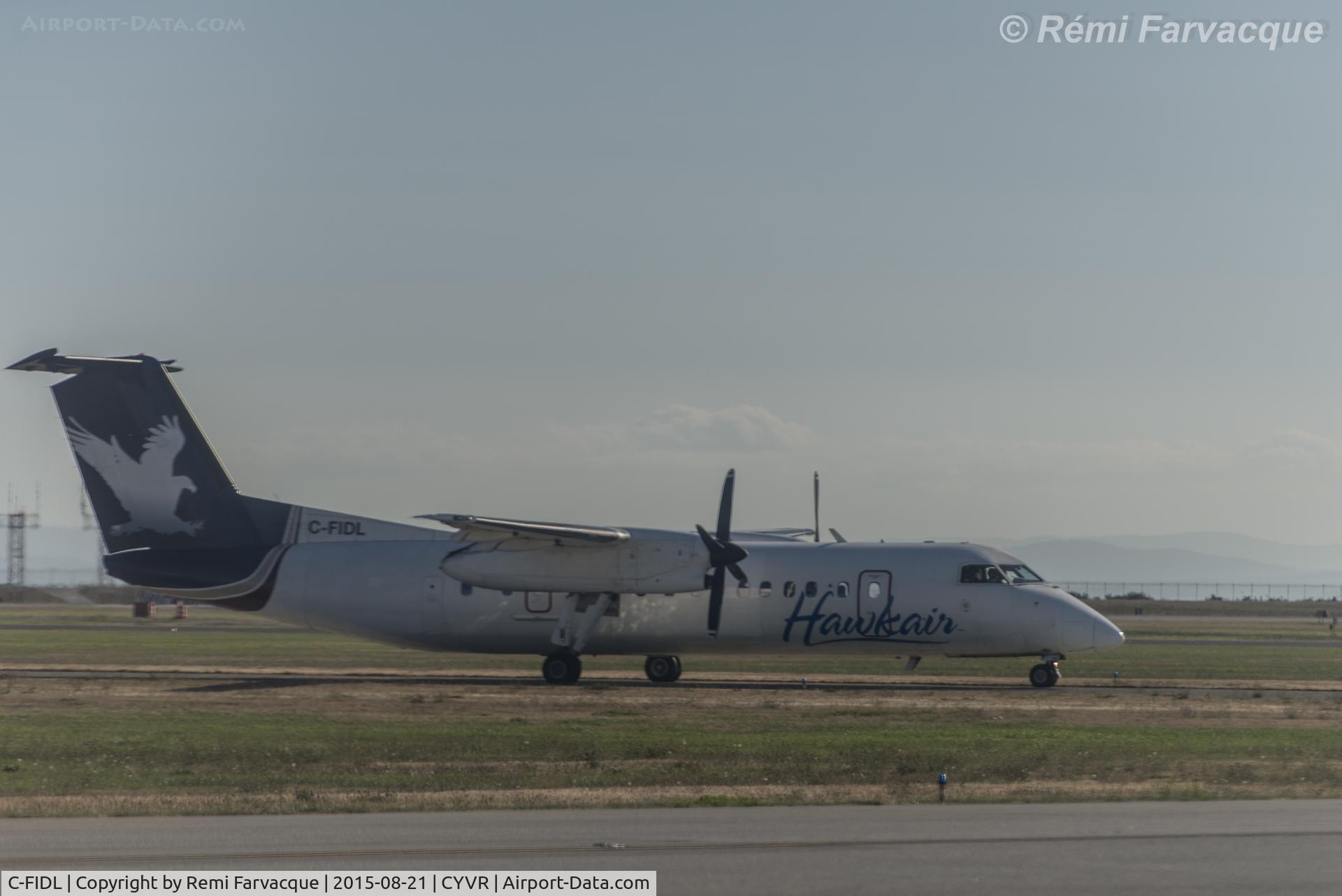 C-FIDL, 1991 De Havilland Canada DHC-8-311A Dash 8 C/N 305, Apologies for the poor quality of the image, was taken from another craft with badly scratched windows.
