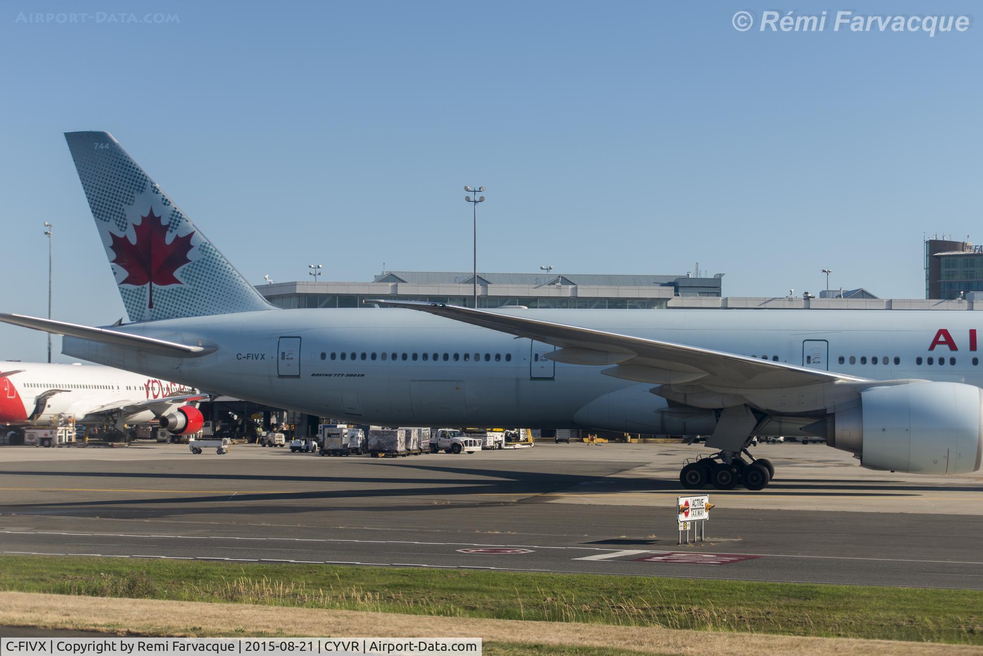 C-FIVX, 2013 Boeing 777-333/ER C/N 42219, Back end, first of two pics - didn't have a wider angle lens with me at the time, but at least you get detail ! Apologies for the poor quality of the image, was taken from another craft with badly scratched windows.