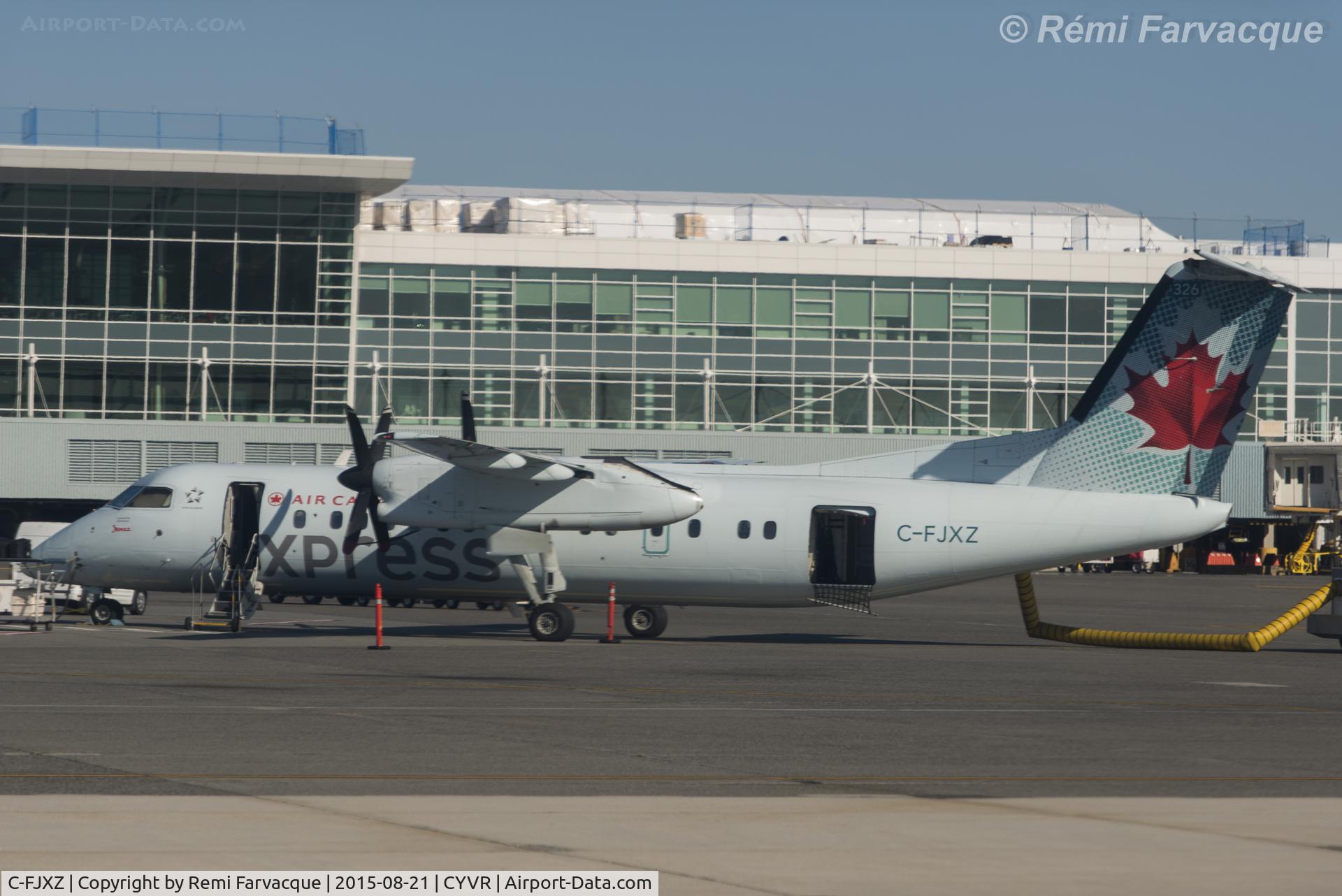 C-FJXZ, 1991 De Havilland Canada DHC-8-311 Dash 8 C/N 264, Apologies for the poor quality of the image, was taken from another craft with badly scratched windows.