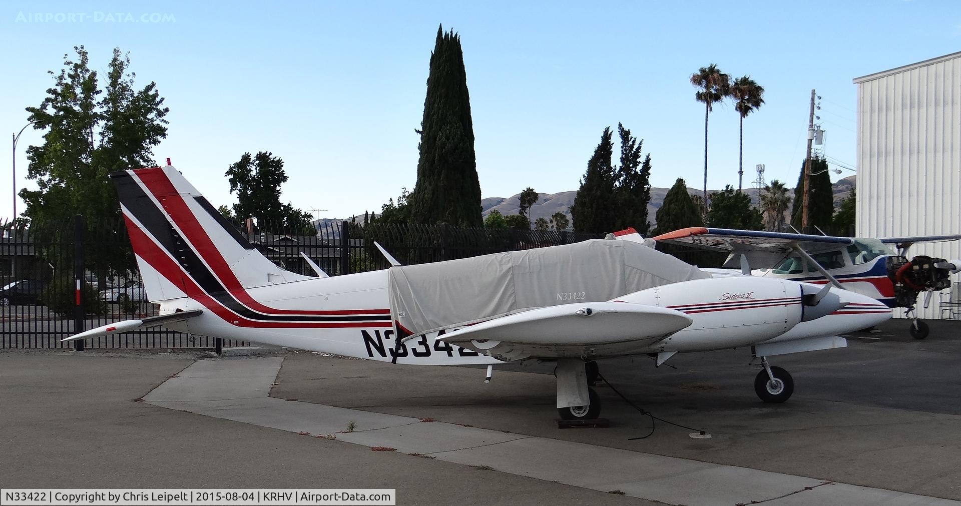 N33422, 1975 Piper PA-34-200T C/N 34-7570117, Locally-based 1975 Piper Seneca sitting in front of the airplane mod shop during sunset at Reid Hillview Airport, San Jose, CA.