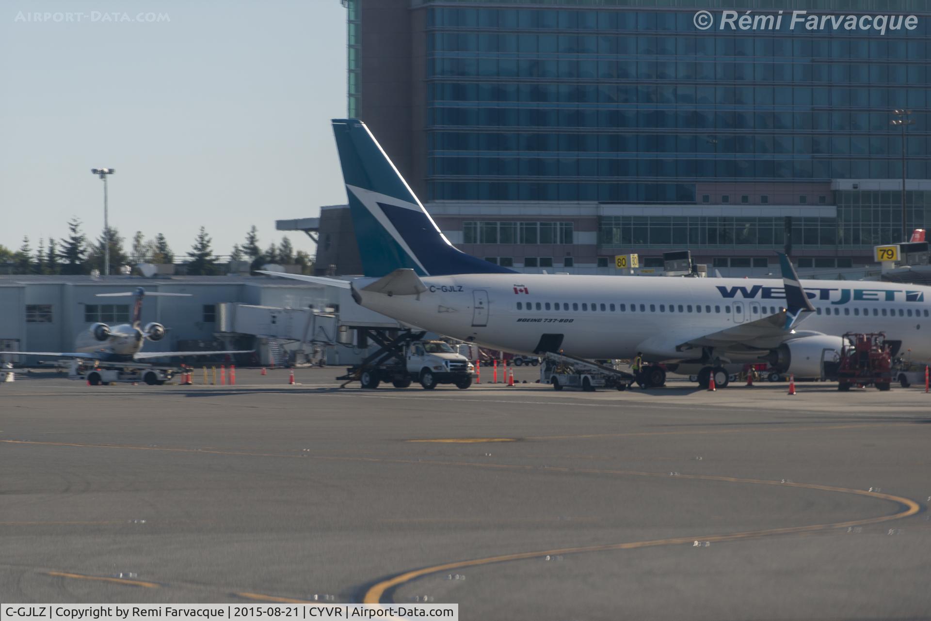 C-GJLZ, 2014 Boeing 737-8CT C/N 60125, Apologies for the poor quality of the image, was taken through the scratched window of another craft.