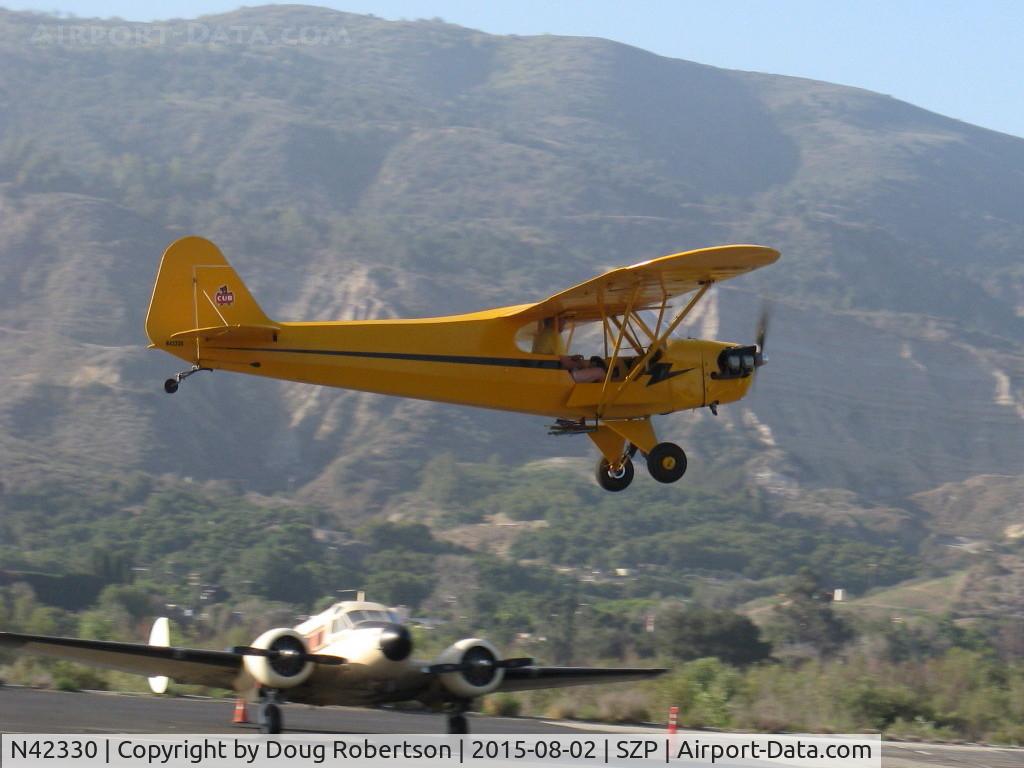N42330, 1941 Piper J3C-65 Cub Cub C/N 14580, 1941 Piper J3C-65 CUB, Continental A&C65 65 Hp, takeoff climb Rwy 22, getting a little air time before being on display at SZP's 85th Anniversary Celebration.