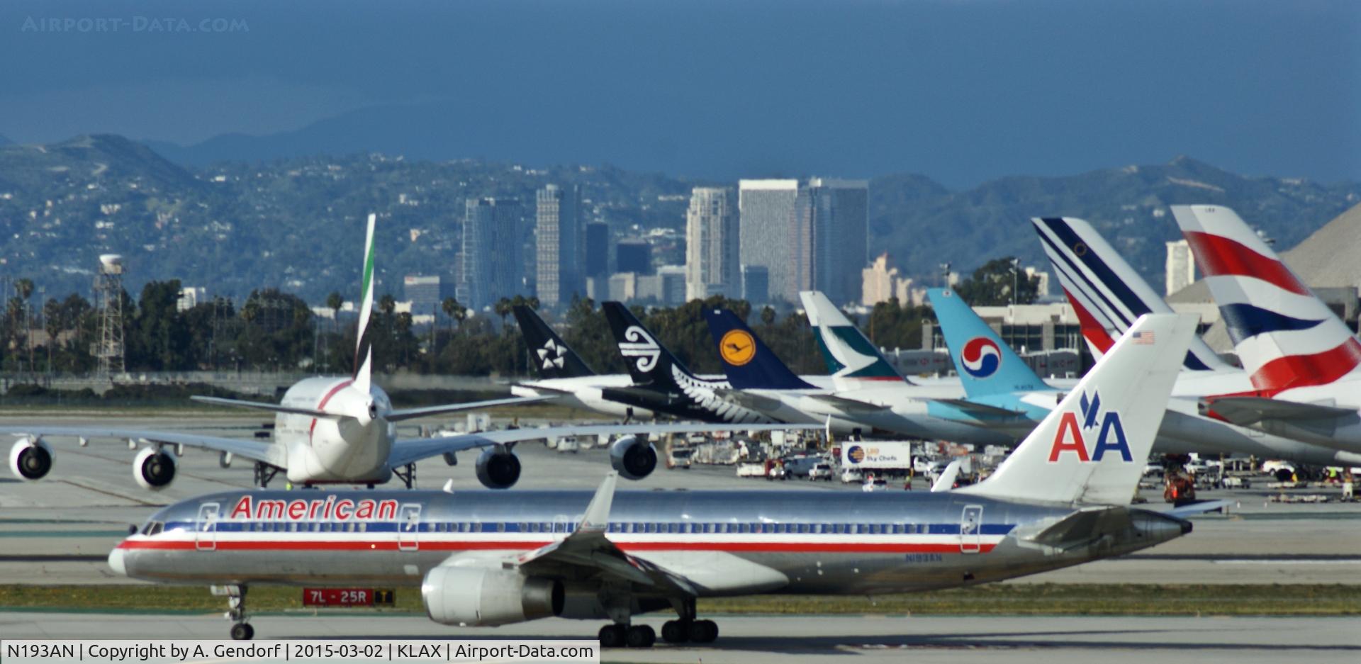 N193AN, 2001 Boeing 757-223 C/N 32387, American Airlines, seen here taxiing in front of all the tails waiting around the Tom Bradley Terminal at Los Angeles Int;l(KLAX)